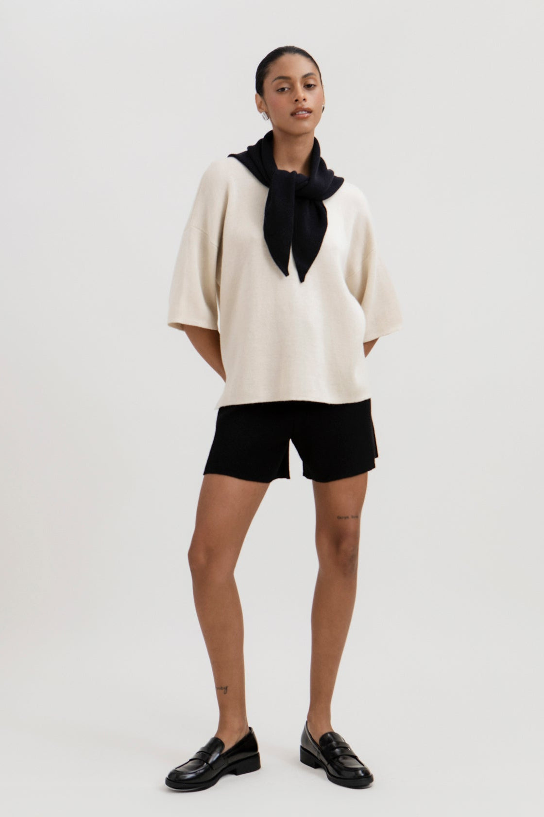 Airy Shorts in Black, alpaca and silk knit shorts by Ahblo, worn by model