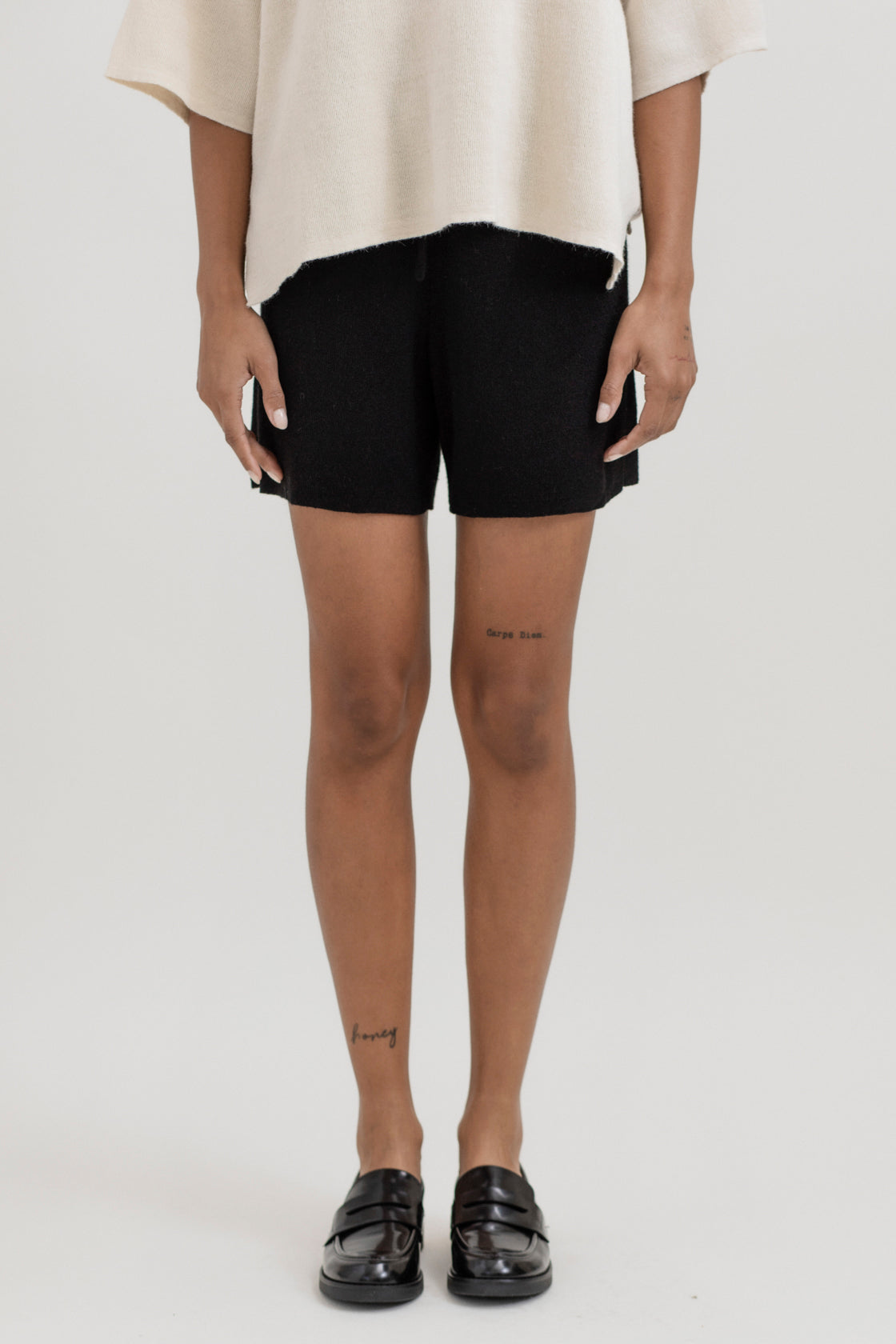 Airy Shorts in Black, alpaca and silk knit shorts by Ahblo, worn by model