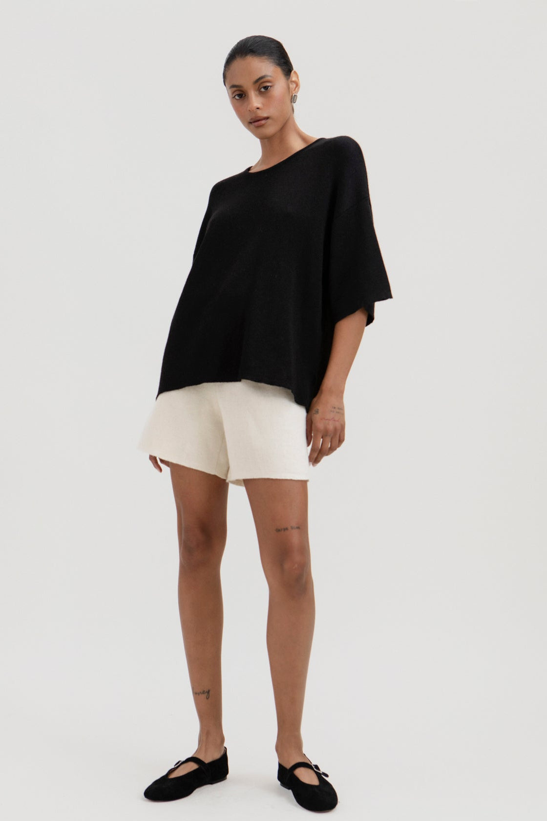 Airy Shorts in Cream, alpaca and silk knit shorts by Ahblo, worn by model