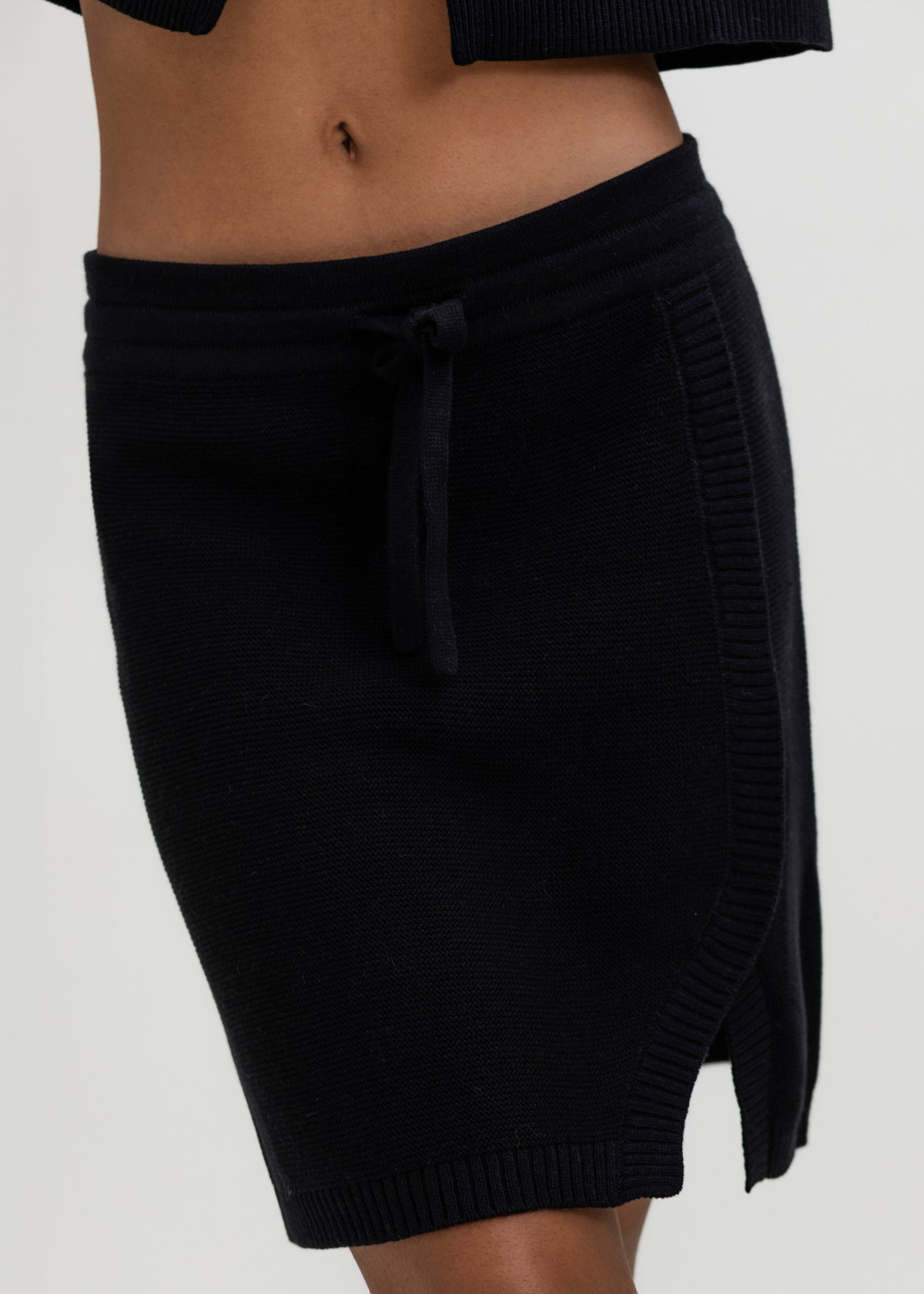 Alin Mini Skirt in Black, cotton and baby alpaca mini skirt by Ahblo, worn by model