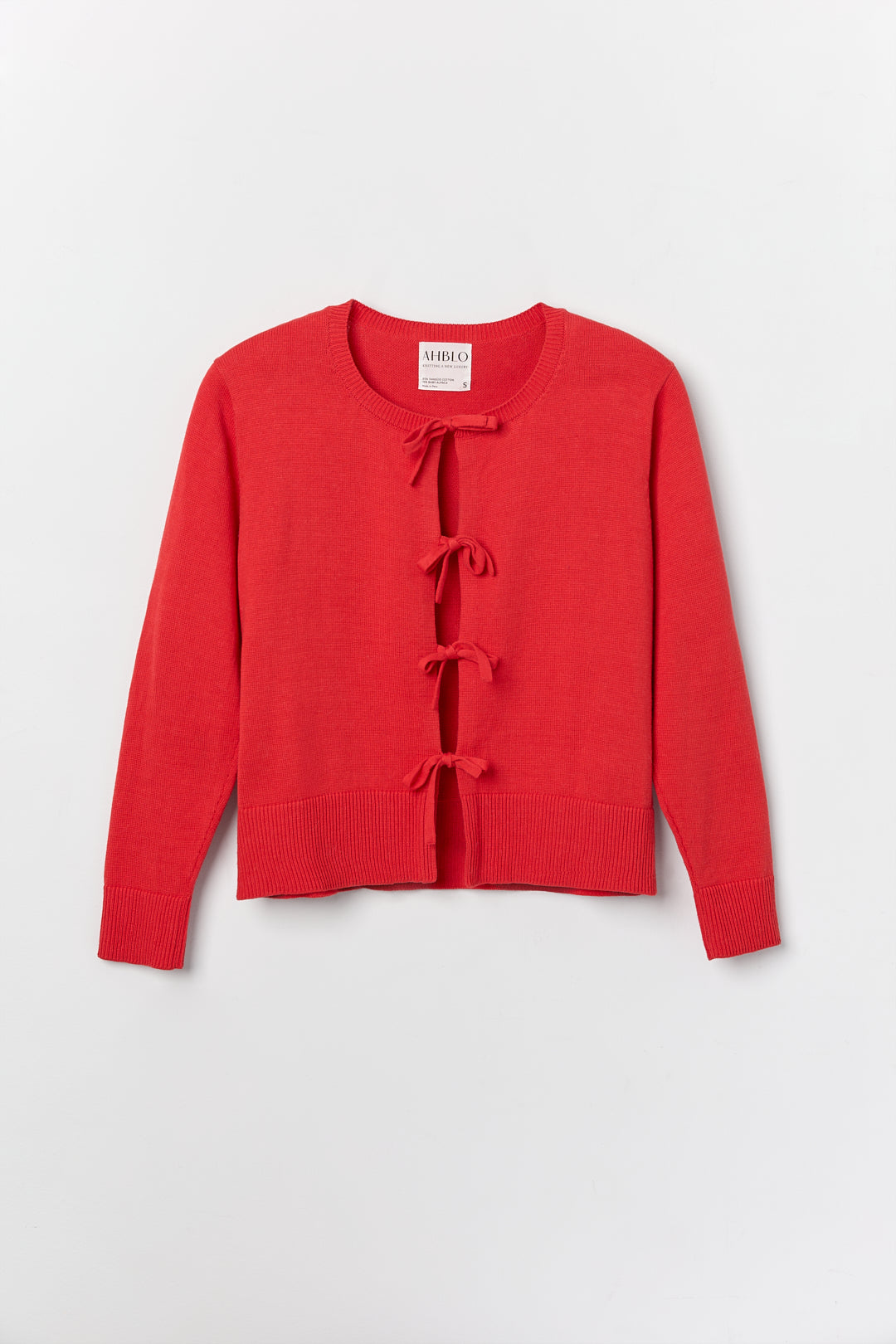 Amaya Cardigan in Cerise, cotton and baby alpaca bow cardigan by Ahblo, flat lay
