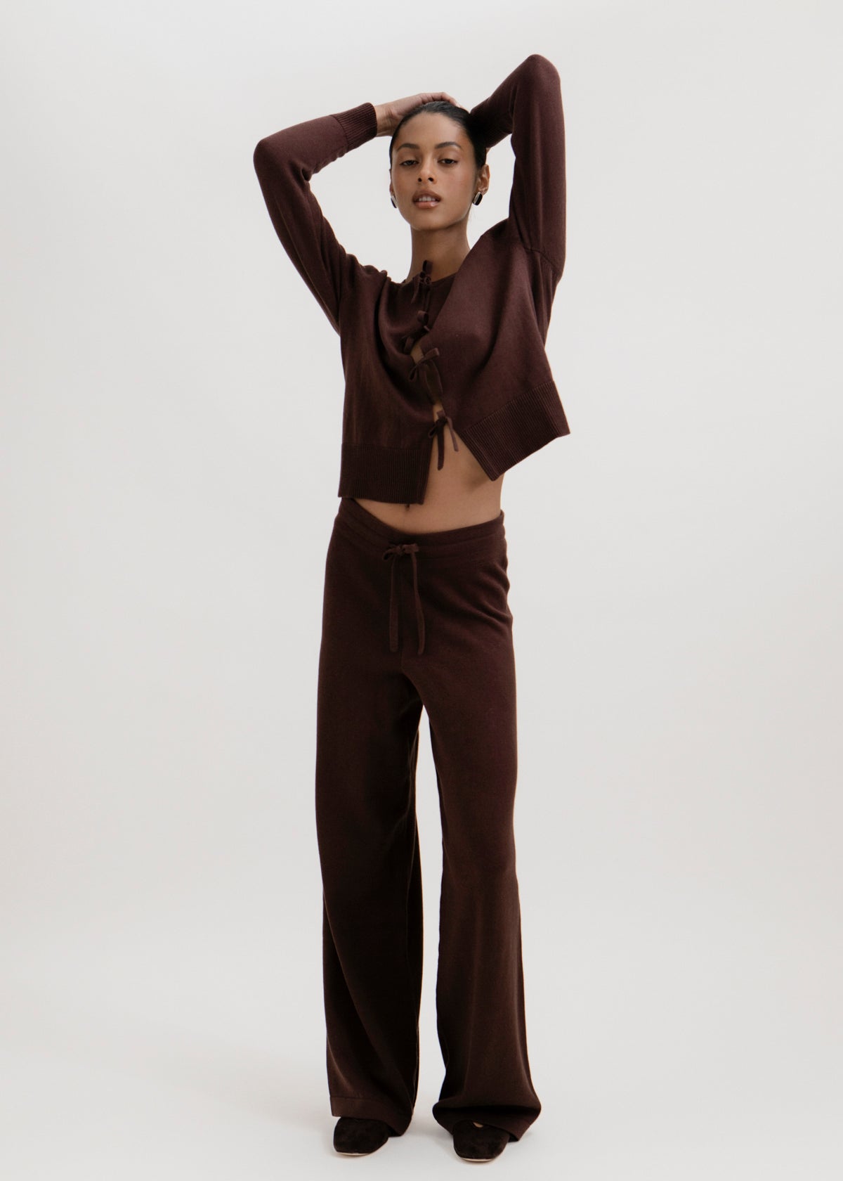 Amaya Cardigan in Chocolate Brown, cotton and baby alpaca bow cardigan by Ahblo, worn by model