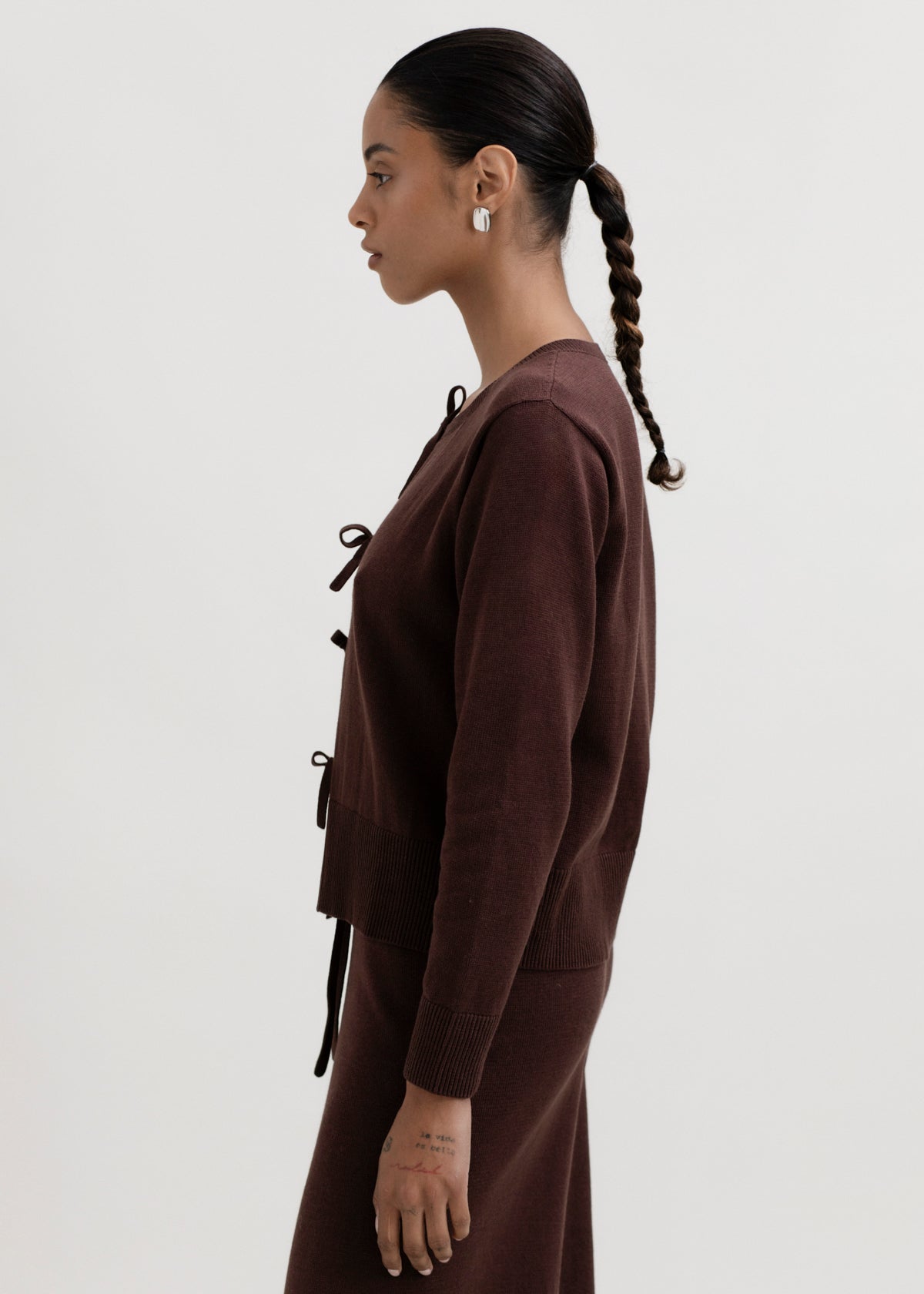 Amaya Cardigan in Chocolate Brown, cotton and baby alpaca bow cardigan by Ahblo, worn by model