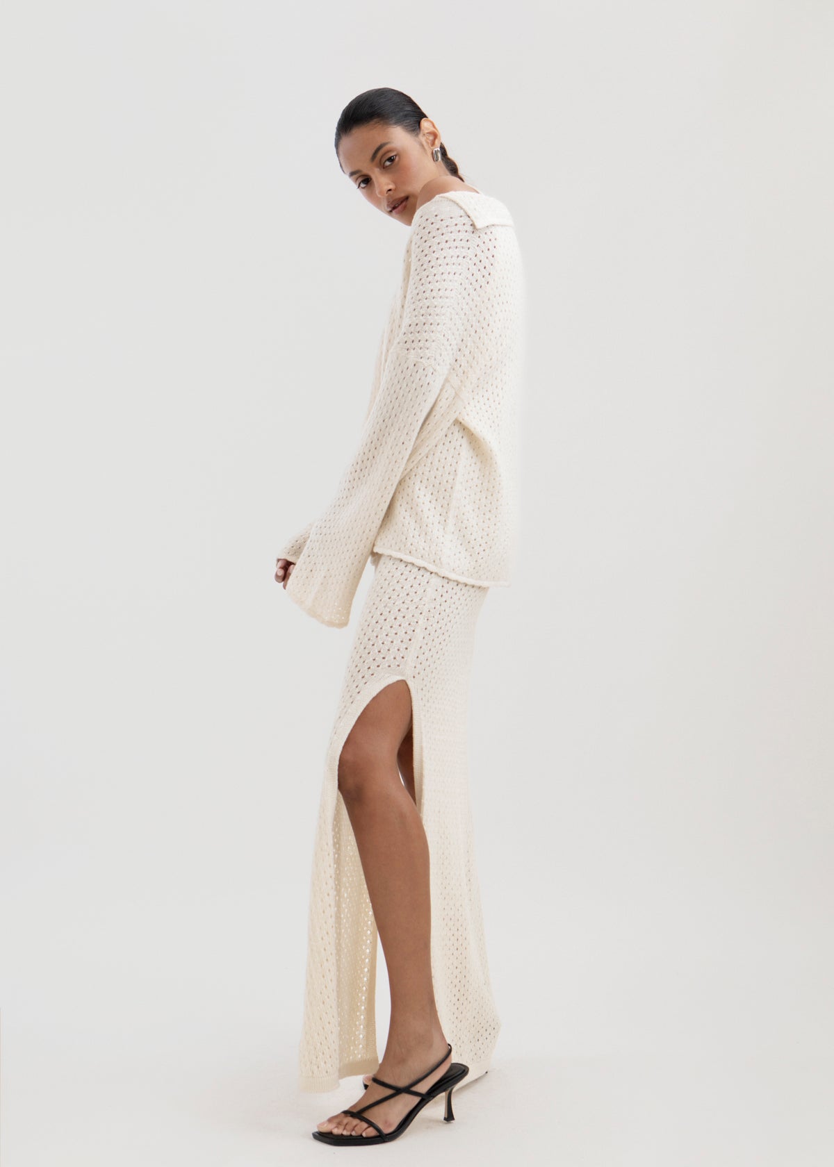Aurora Dress in Cream, baby alpaca knit maxi dress by Ahblo, worn by model