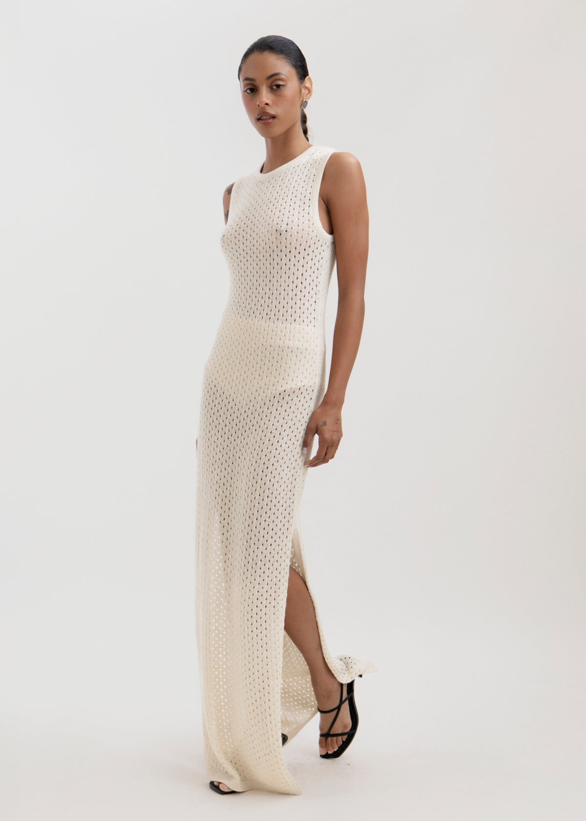 Aurora Dress in Cream, baby alpaca knit maxi dress by Ahblo, worn by model