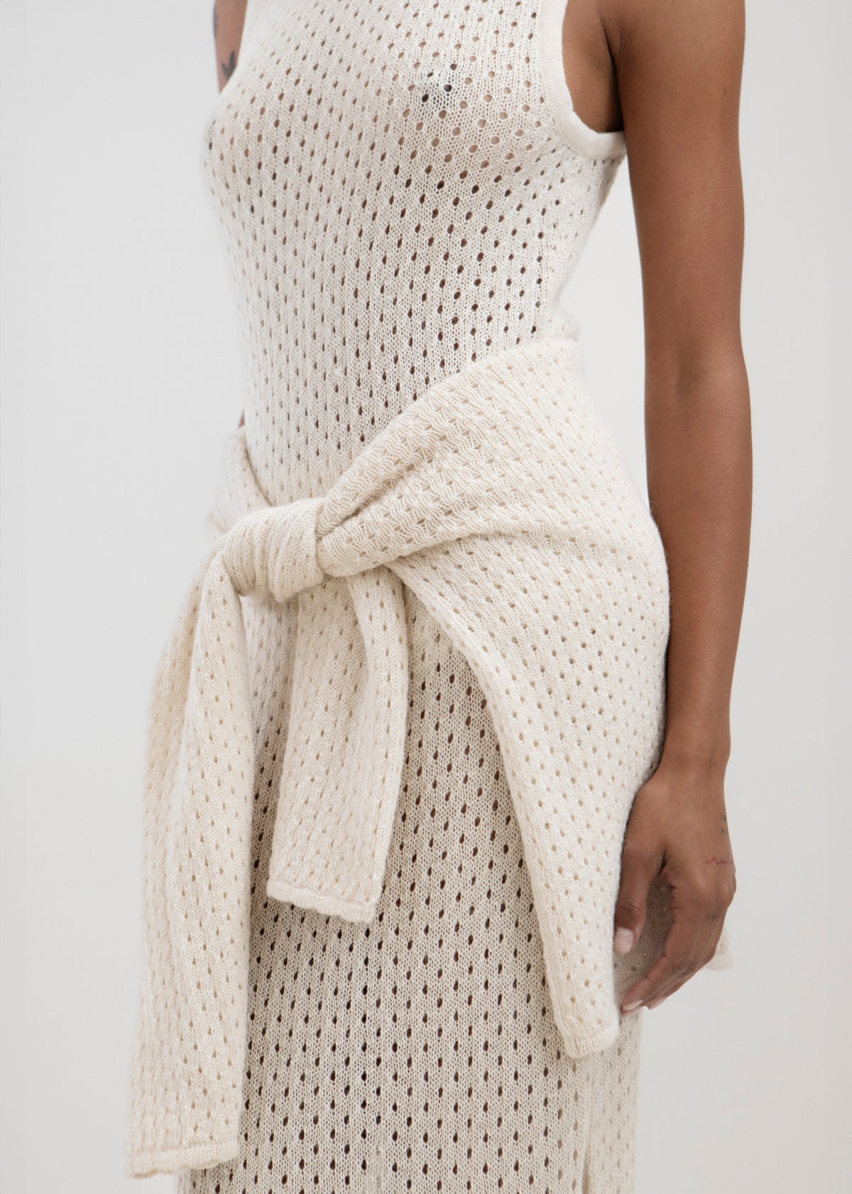 Aurora Dress in Cream, baby alpaca knit maxi dress by Ahblo, worn by model