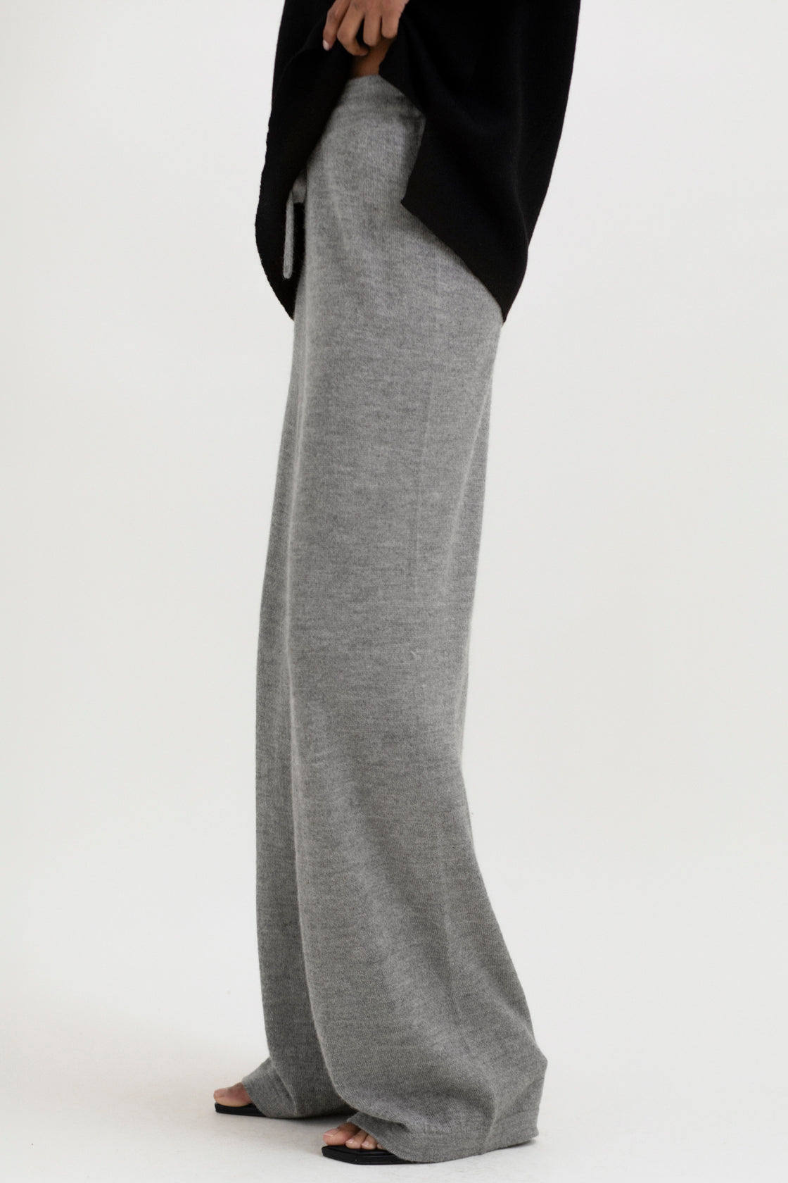 Avery Trousers in Mist Grey, baby alpaca wide-leg knit trousers by Ahblo, worn by model
