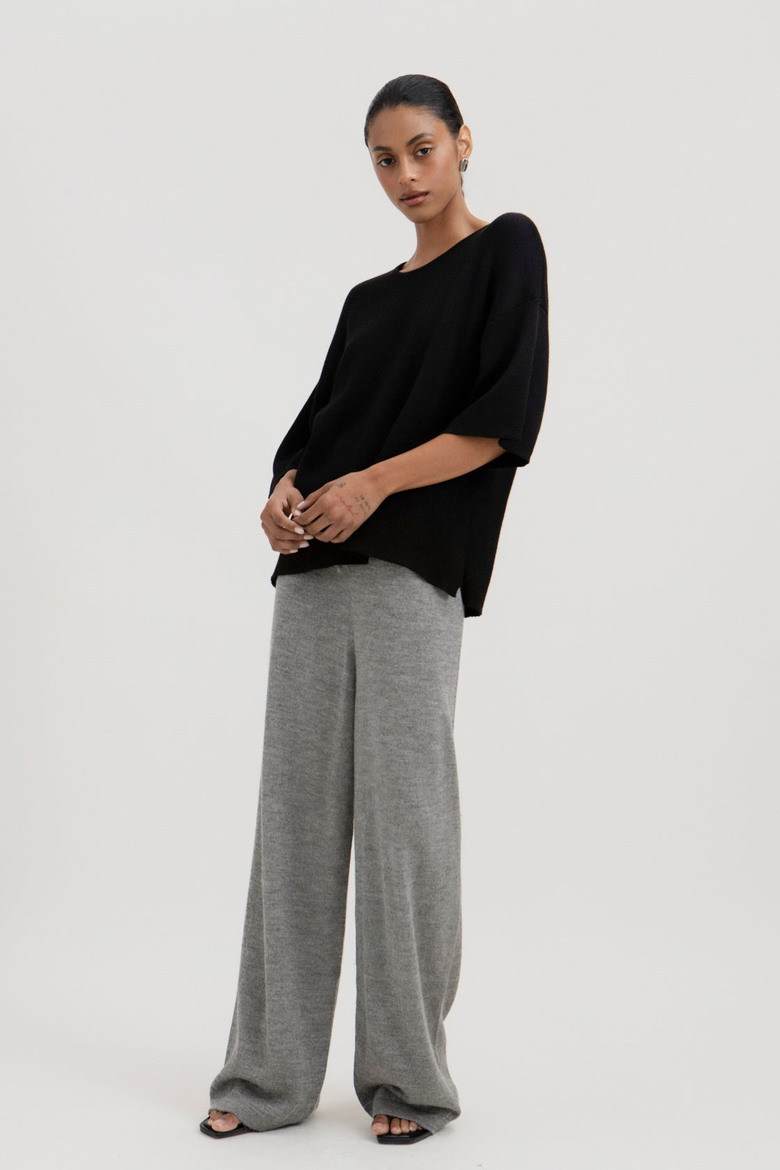 Avery Trousers in Mist Grey, baby alpaca wide-leg knit trousers by Ahblo, worn by model