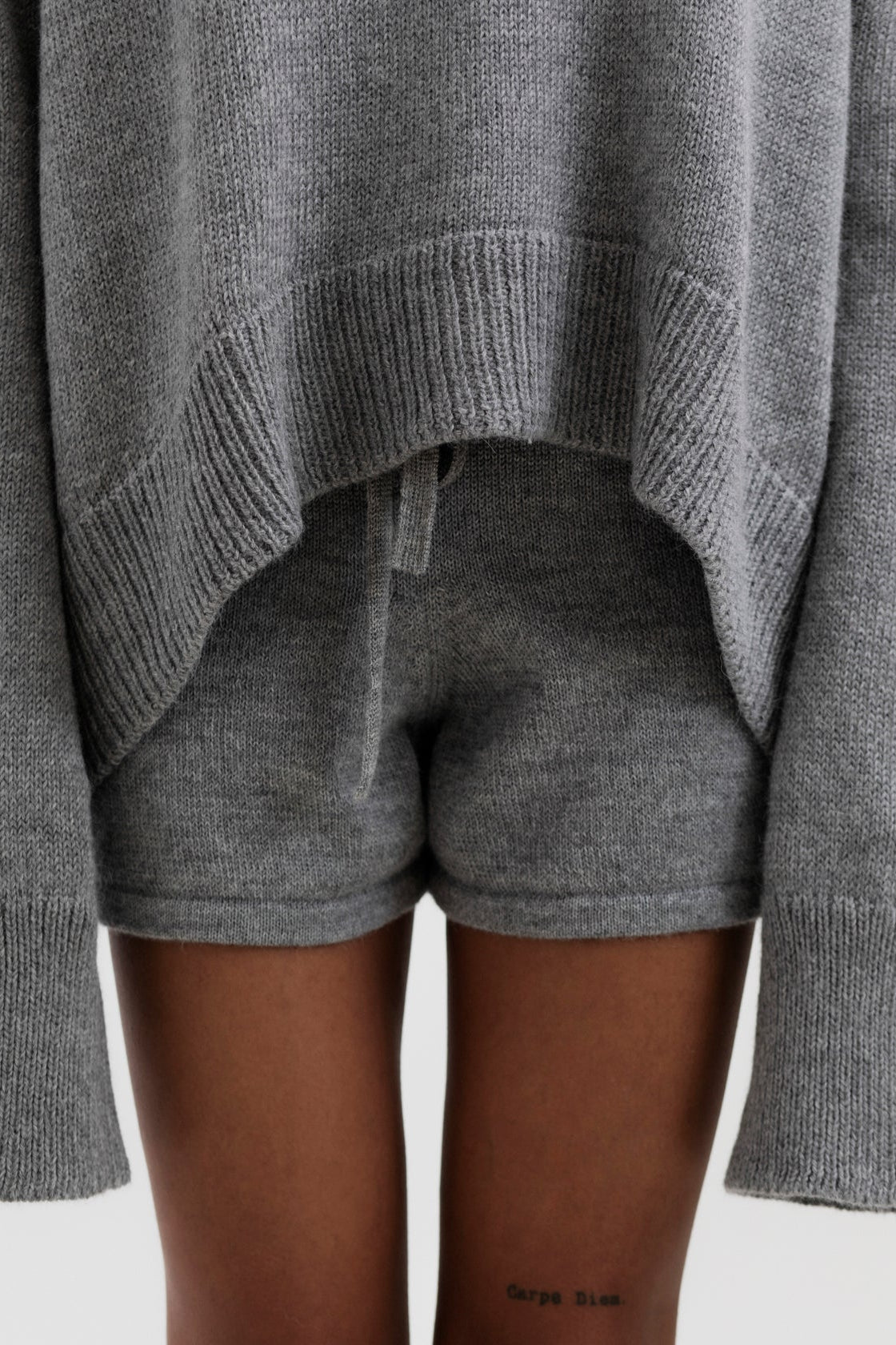 Cove Shorts in Mist Grey, baby alpaca knit shorts by Ahblo, worn by model