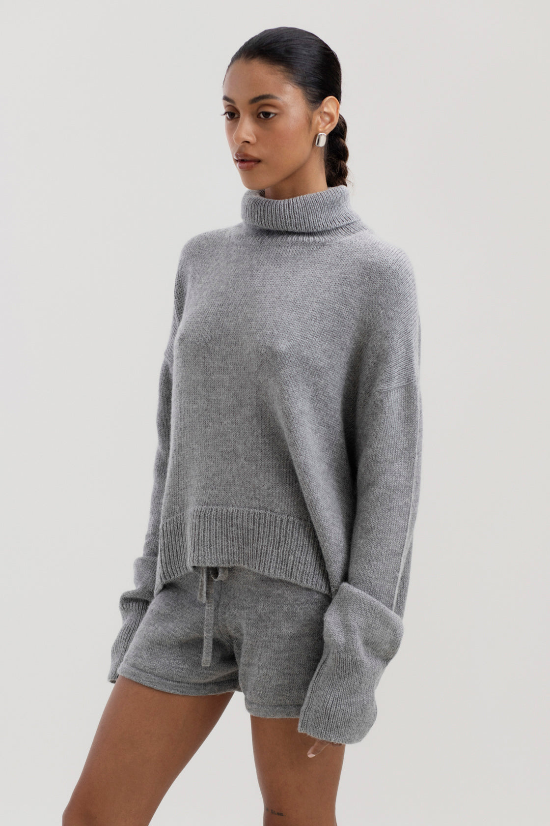 Cove Shorts in Mist Grey, baby alpaca knit shorts by Ahblo, worn by model