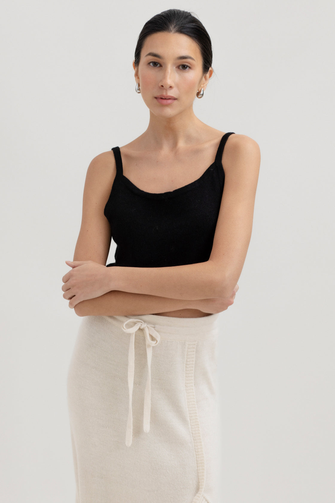 Halo Top in Black, alpaca knit cropped top by Ahblo, worn by model