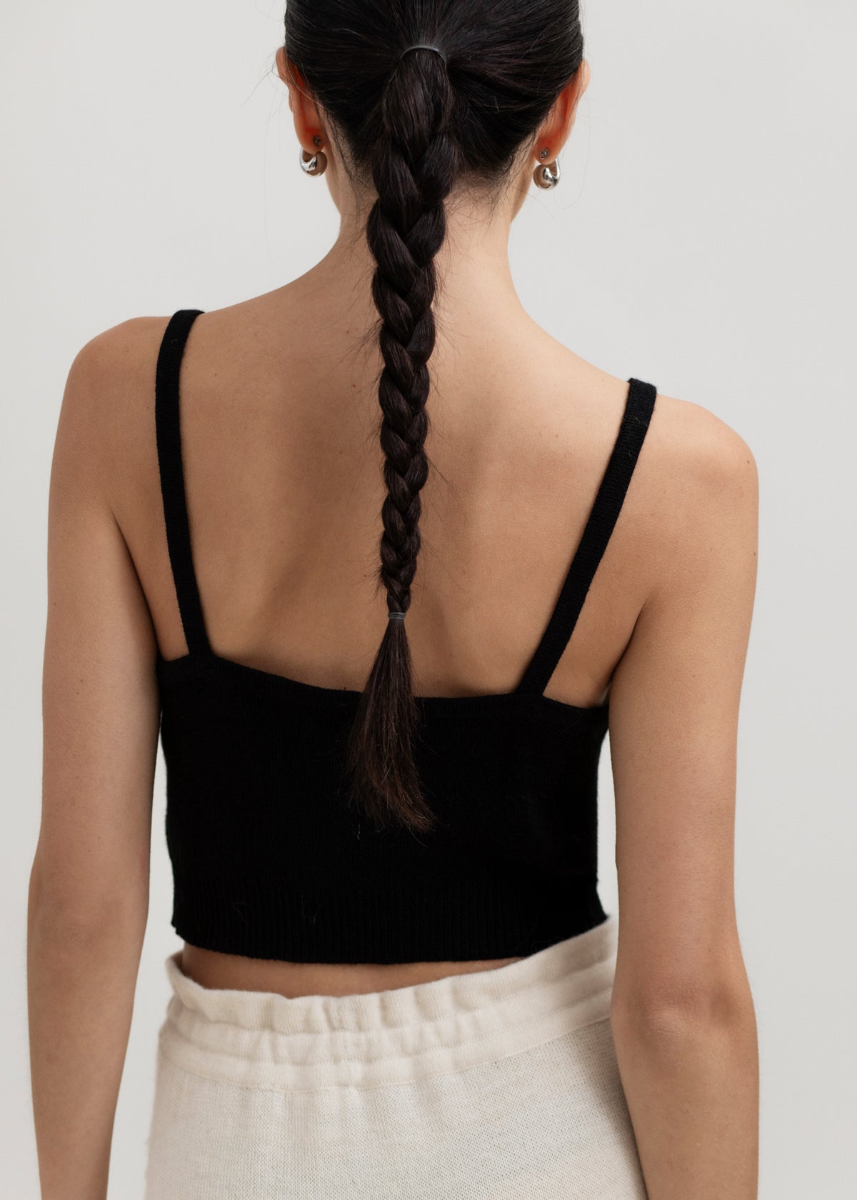 Halo Top in Black, alpaca knit cropped top by Ahblo, worn by model