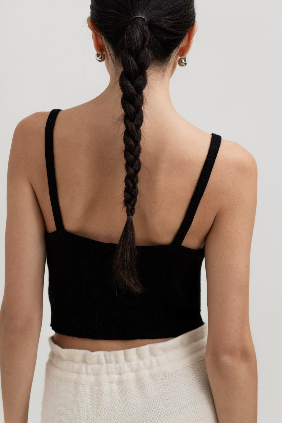 Halo Top in Black, alpaca knit cropped top by Ahblo, worn by model