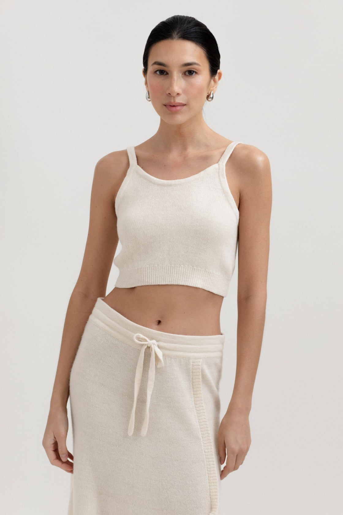 Halo Top in Cream, alpaca knit cropped top by Ahblo, worn by model
