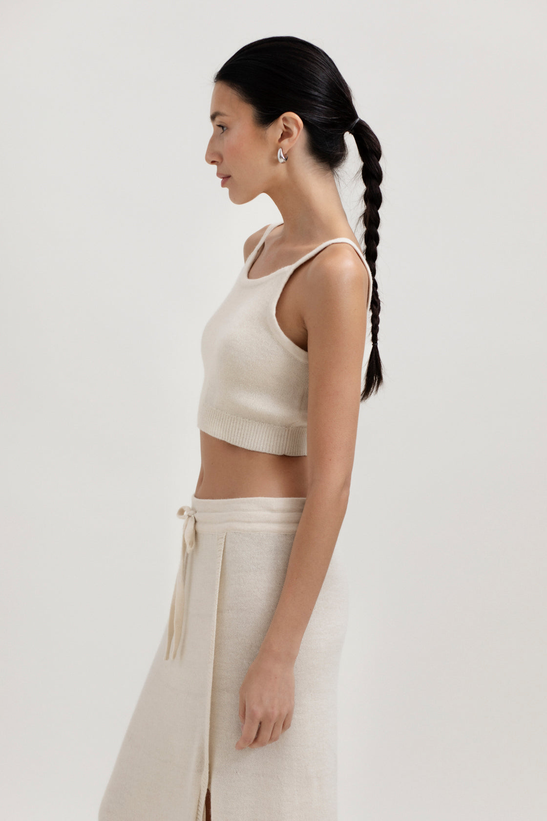 Halo Top in Cream, alpaca knit cropped top by Ahblo, worn by model