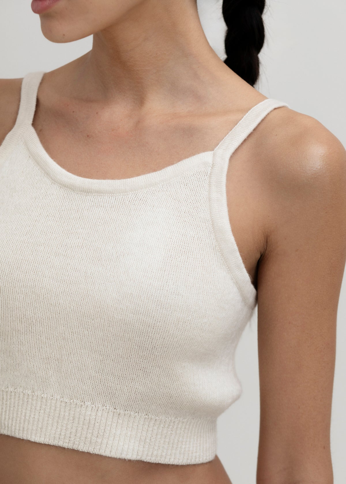 Halo Top in Cream, alpaca knit cropped top by Ahblo, worn by model