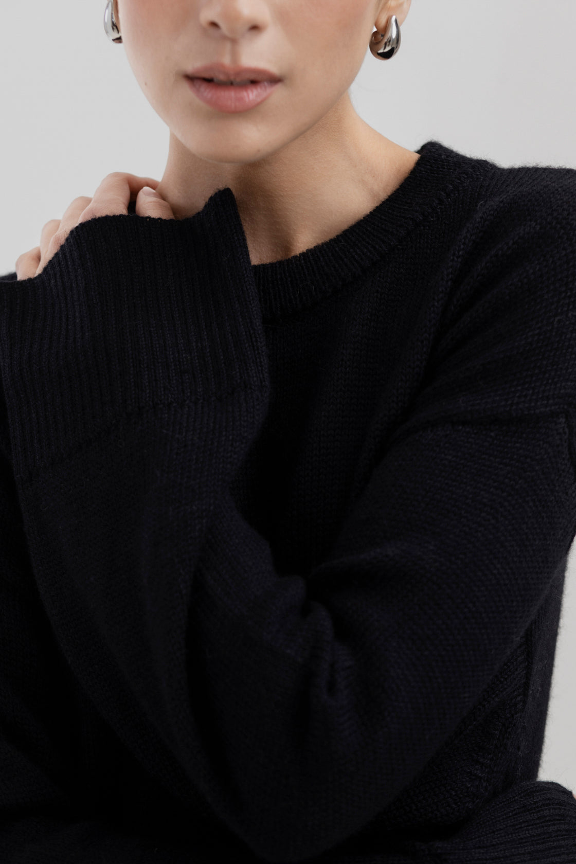 Haven Crew in Black, baby alpaca crew-neck sweater by Ahblo, worn by model