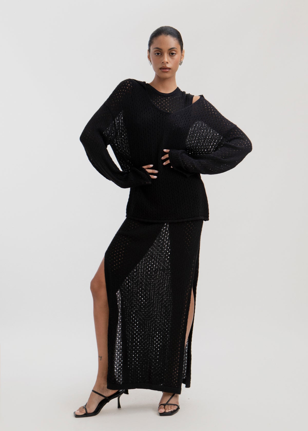 Haze Sweater in Black, baby alpaca crochet-knit sweater by Ahblo, worn by model
