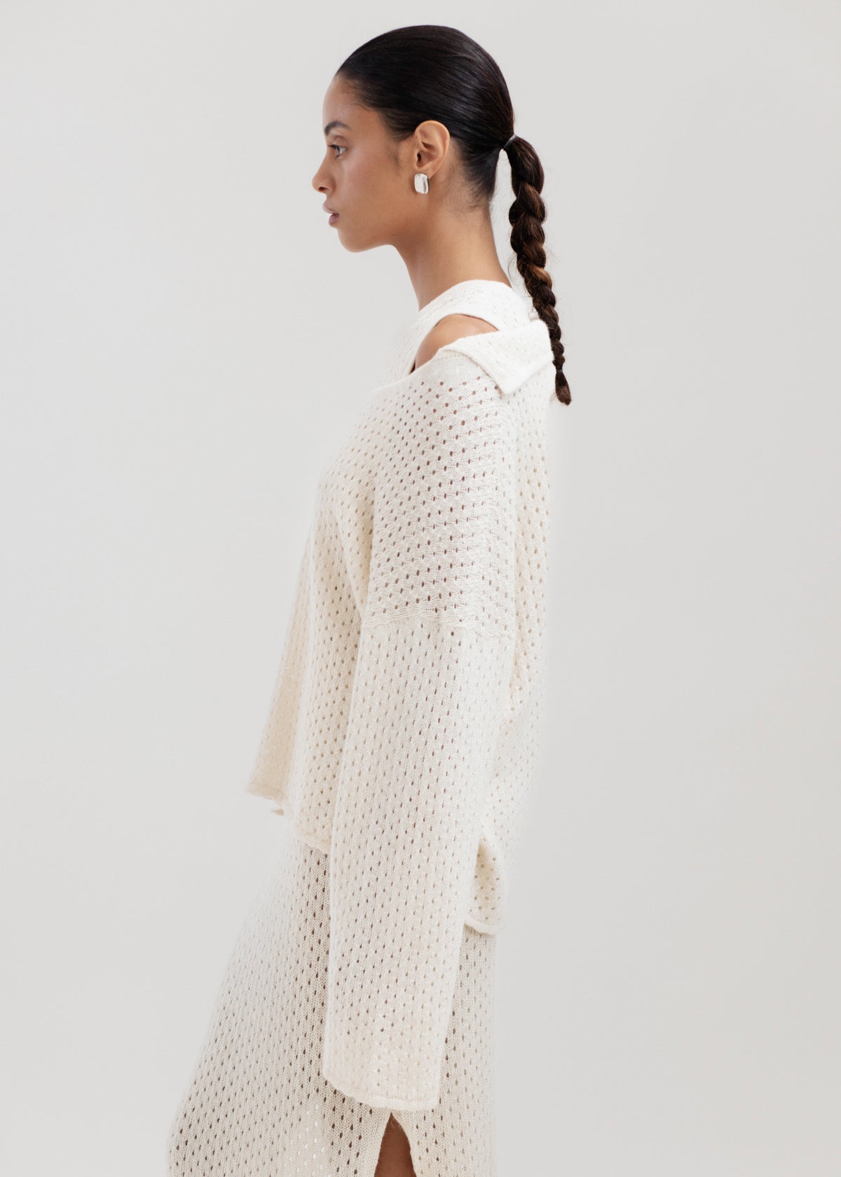 Haze Sweater in Cream, baby alpaca crochet-knit sweater by Ahblo, worn by model