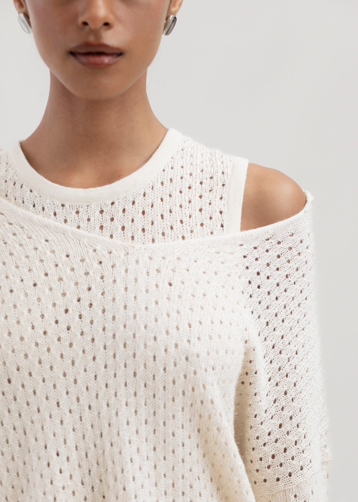 Haze Sweater in Cream, baby alpaca crochet-knit sweater by Ahblo, worn by model
