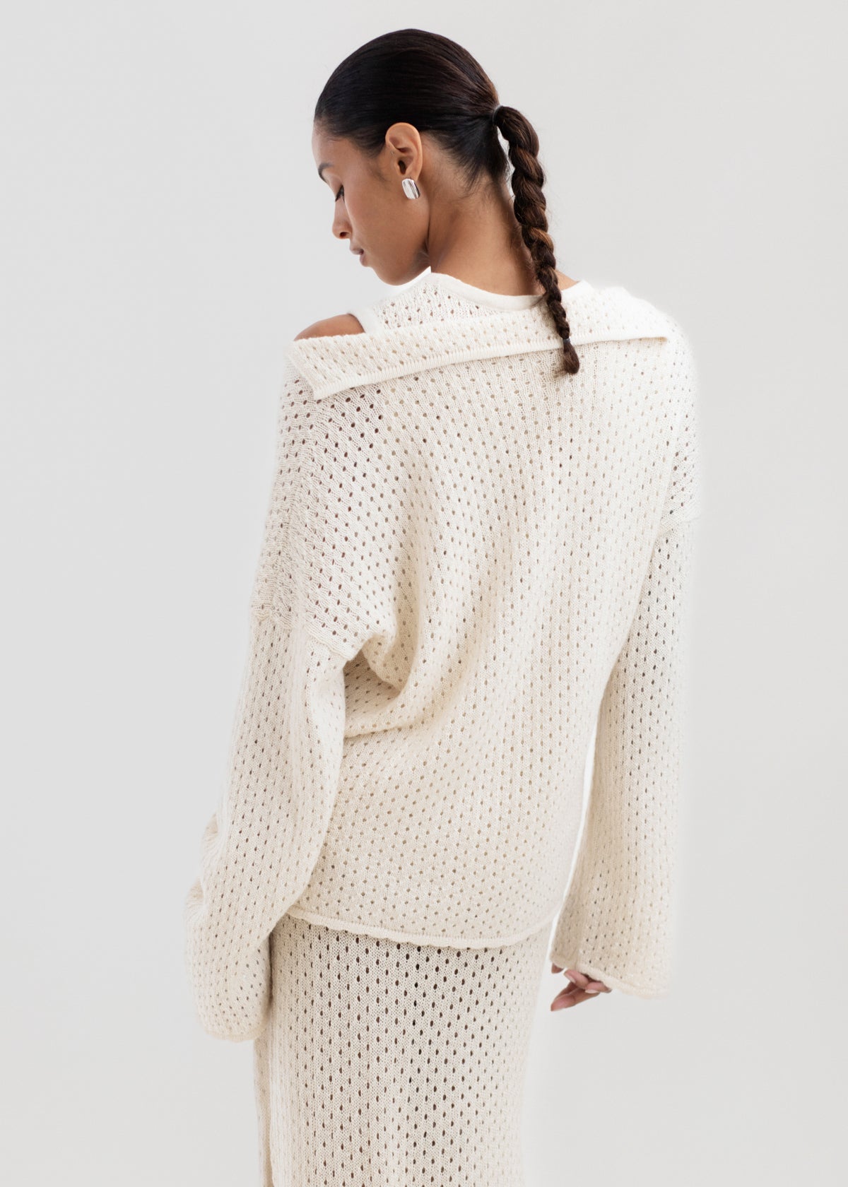 Haze Sweater in Cream, baby alpaca crochet-knit sweater by Ahblo, worn by model