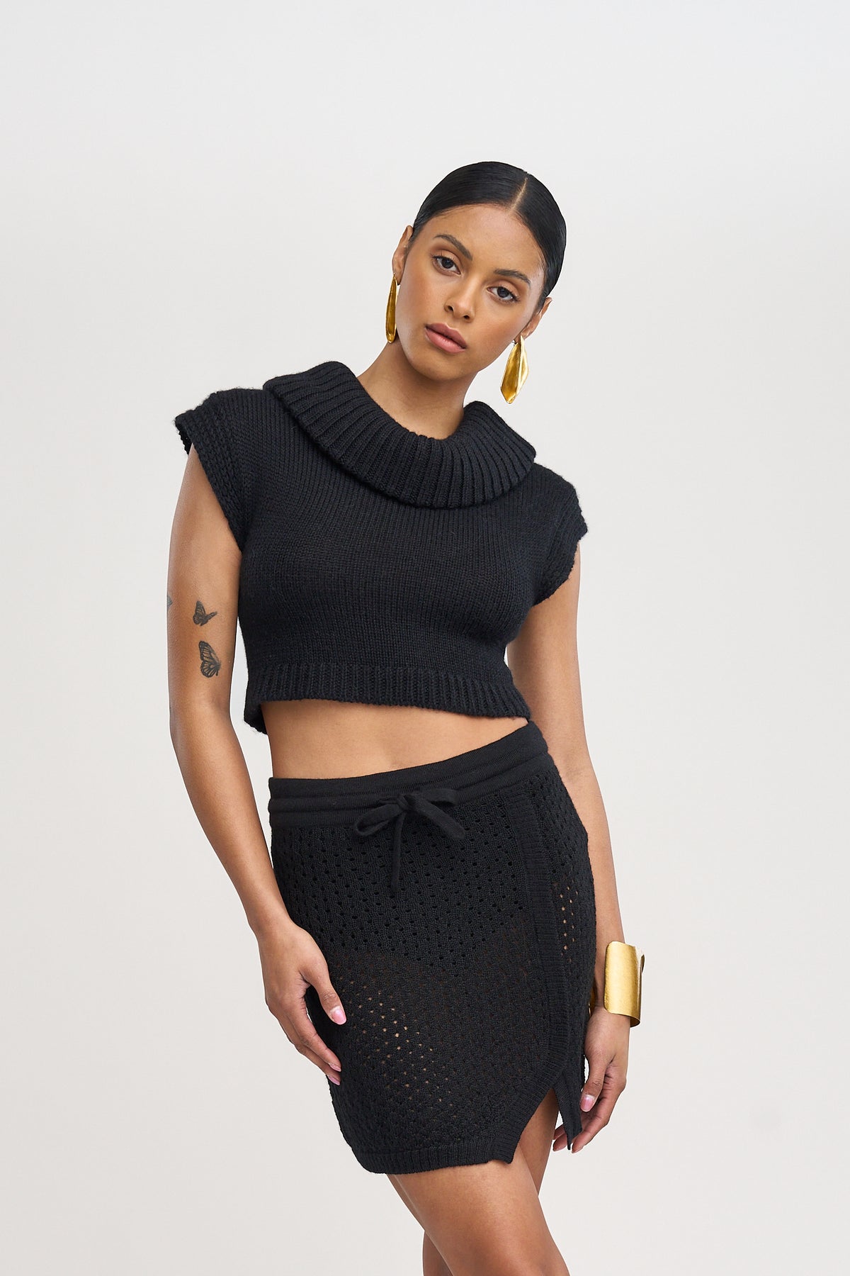Lani Mini Skirt in Black, baby alpaca knit mini skirt by Ahblo, worn by model