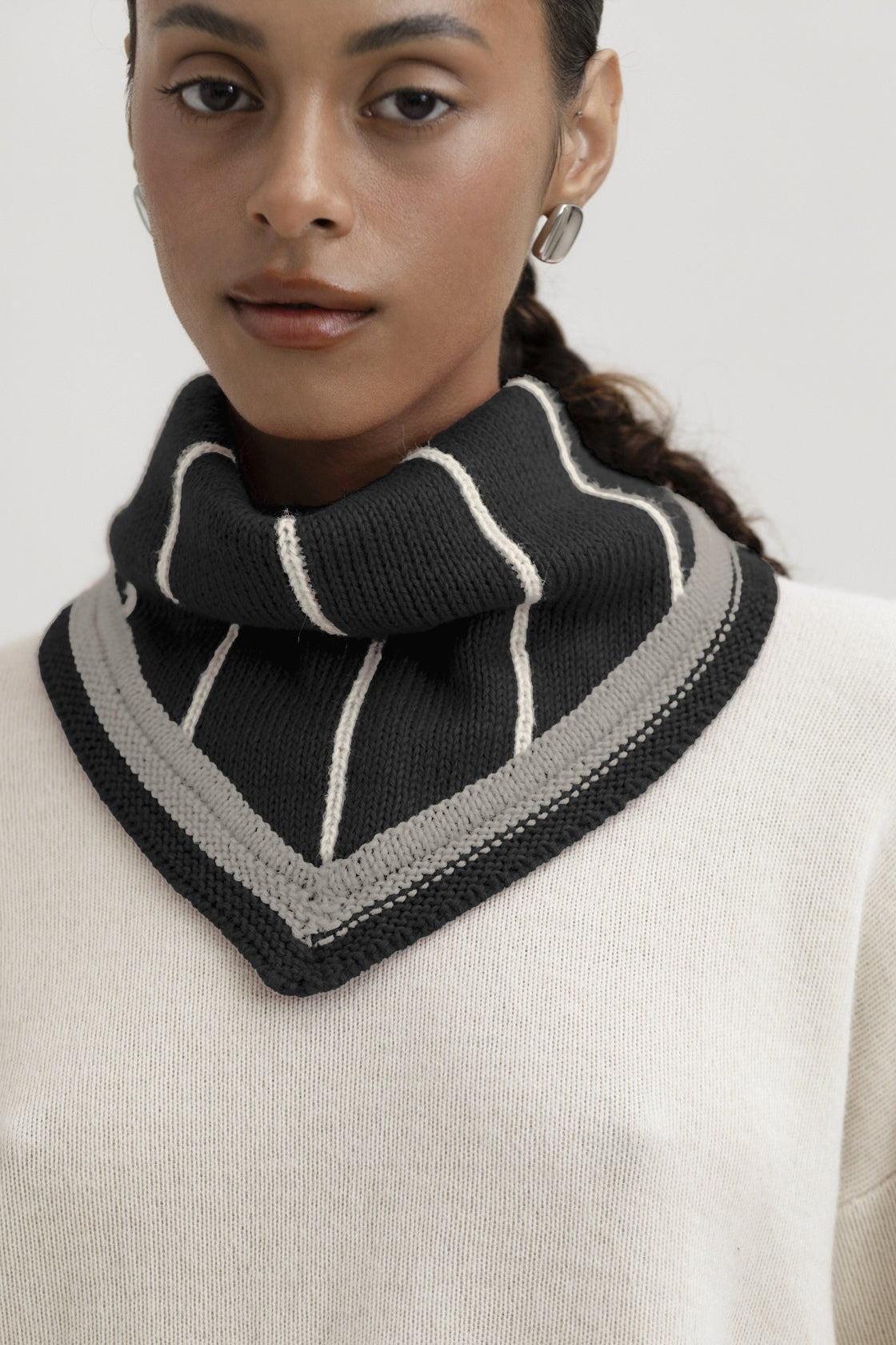 Lina Scarf in Grey, reversible striped baby alpaca triangle scarf by Ahblo, worn by model