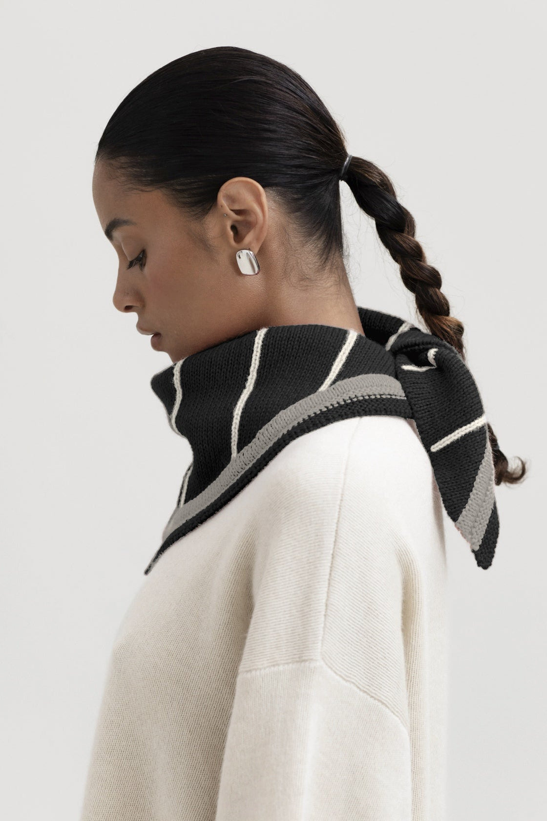 Lina Scarf in Grey, reversible striped baby alpaca triangle scarf by Ahblo, worn by model