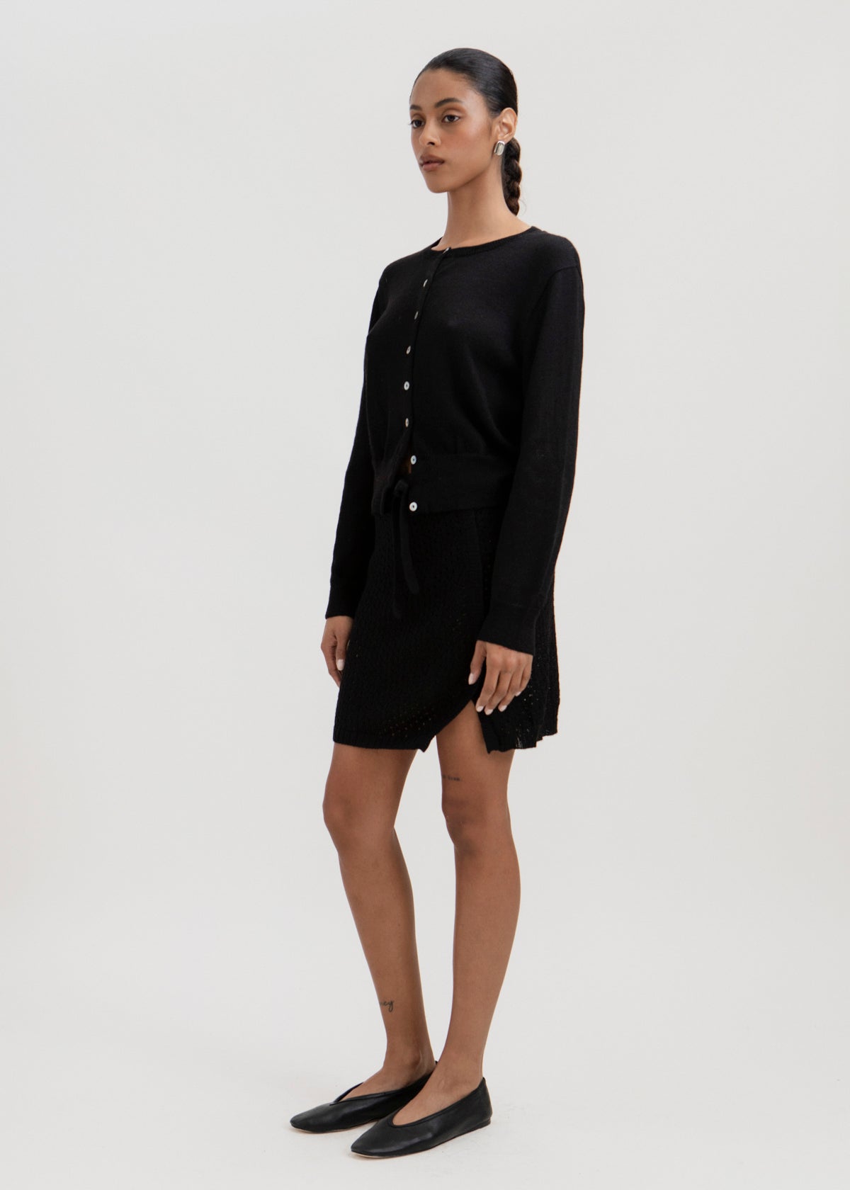 Lulu Cardigan in Black, alpaca cardigan by Ahblo, worn by model