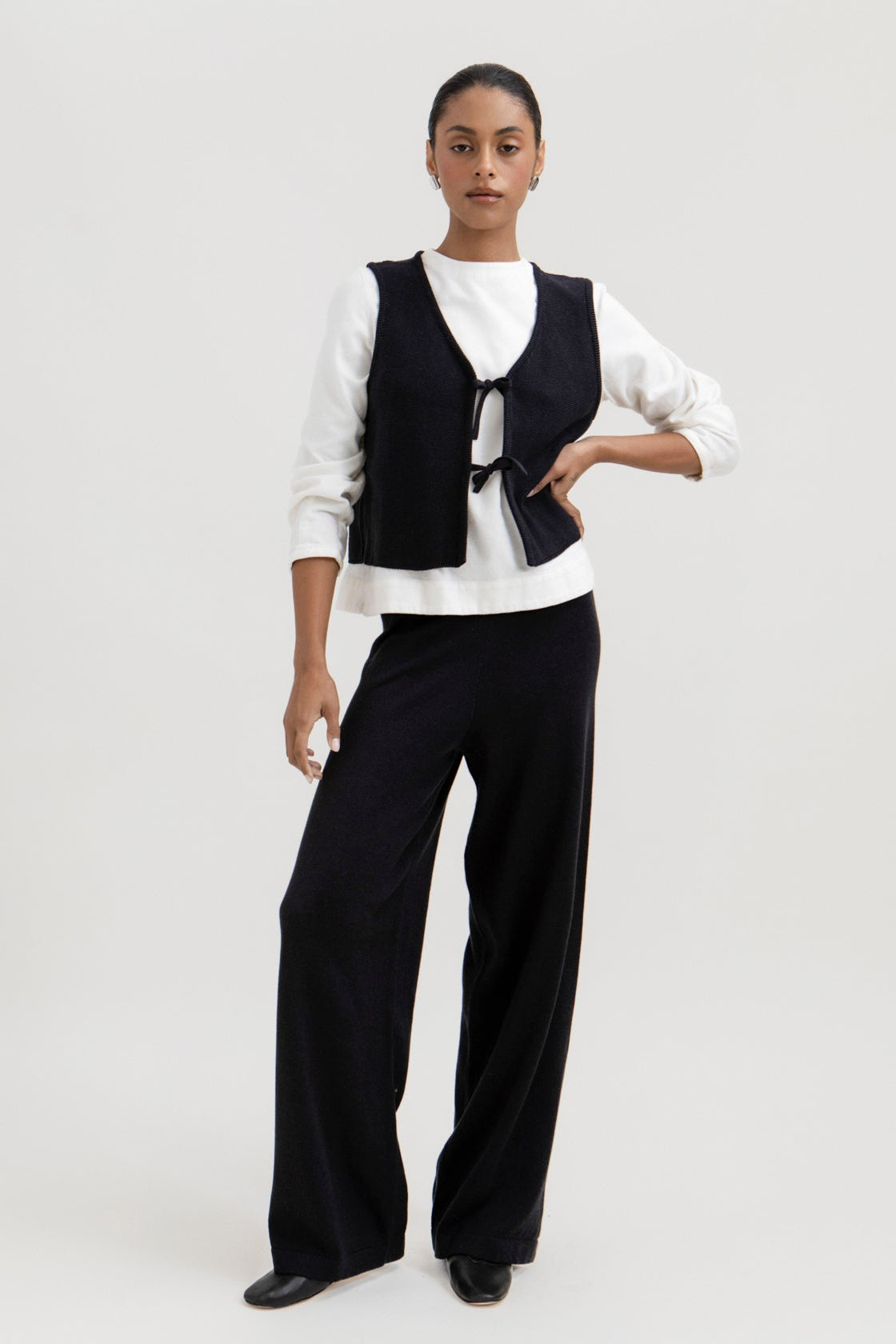 Luzia Vest in Black, cotton and baby alpaca knit vest by Ahblo, worn by model