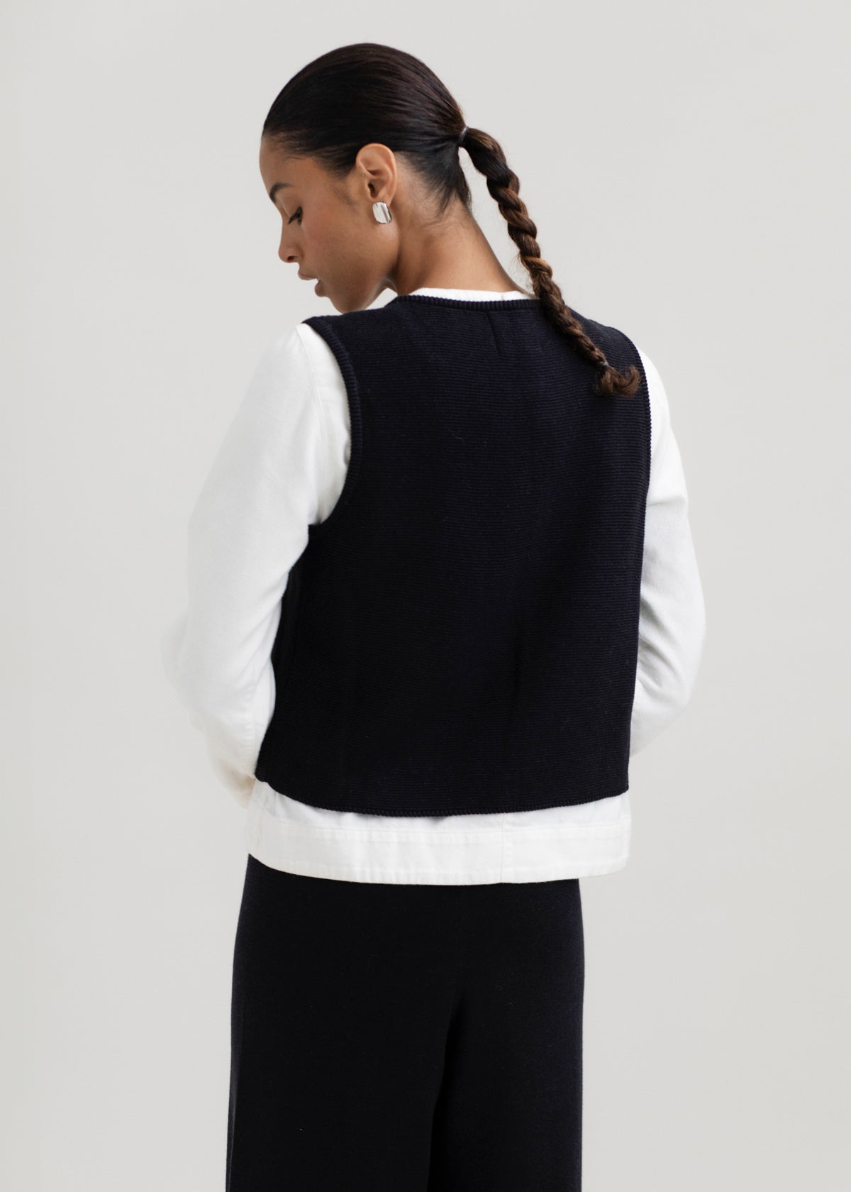 Luzia Vest in Black, cotton and baby alpaca knit vest by Ahblo, worn by model