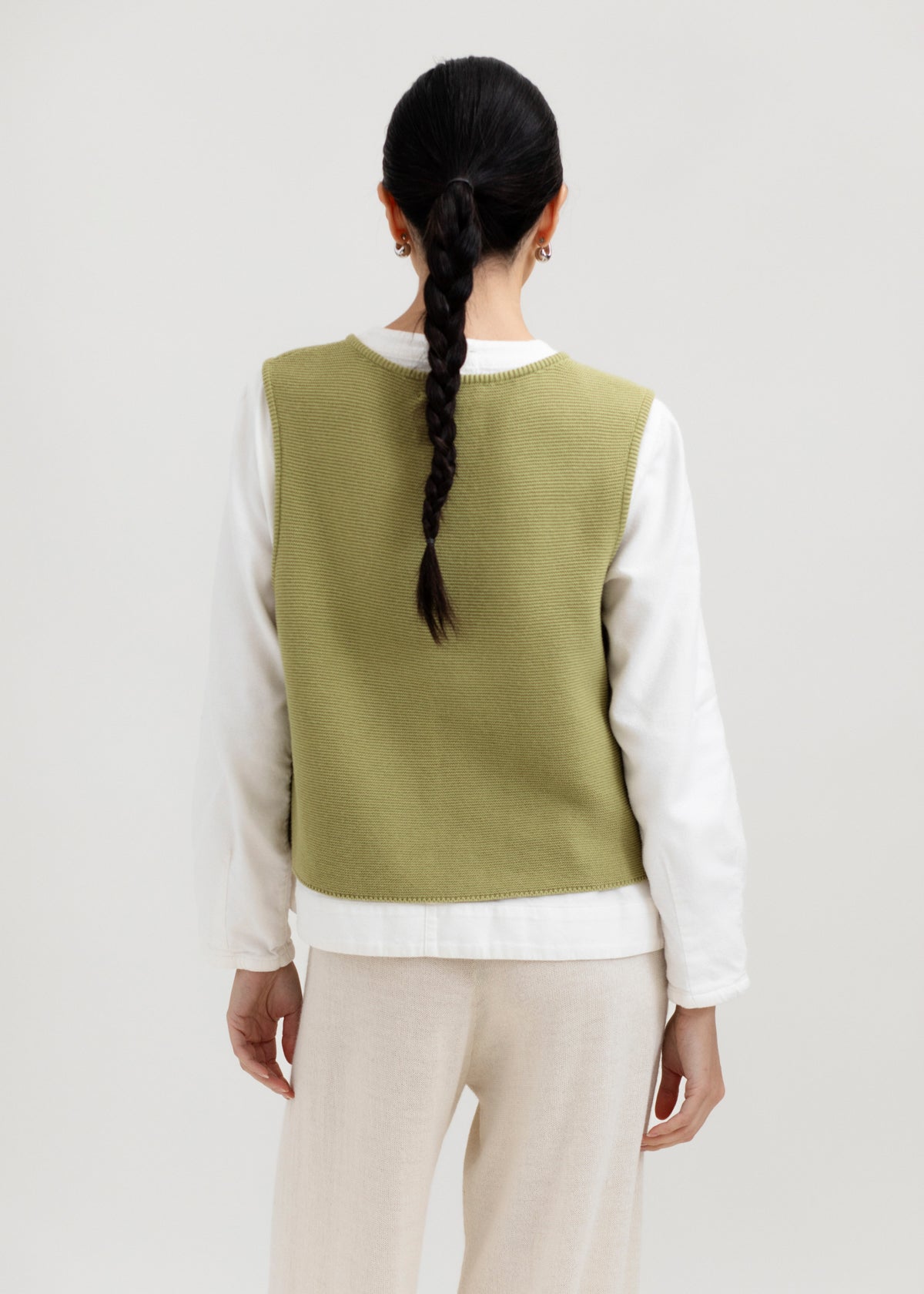 Luzia Vest in Olive, cotton and baby alpaca knit vest by Ahblo, worn by model