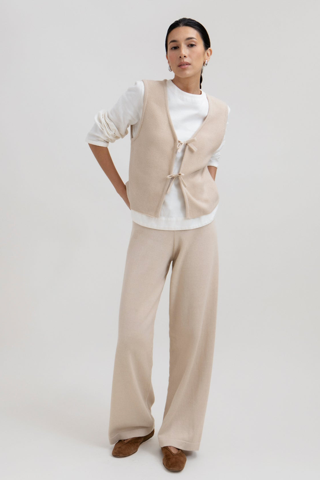 Luzia Vest in Praline, cotton and baby alpaca knit vest by Ahblo, worn by model