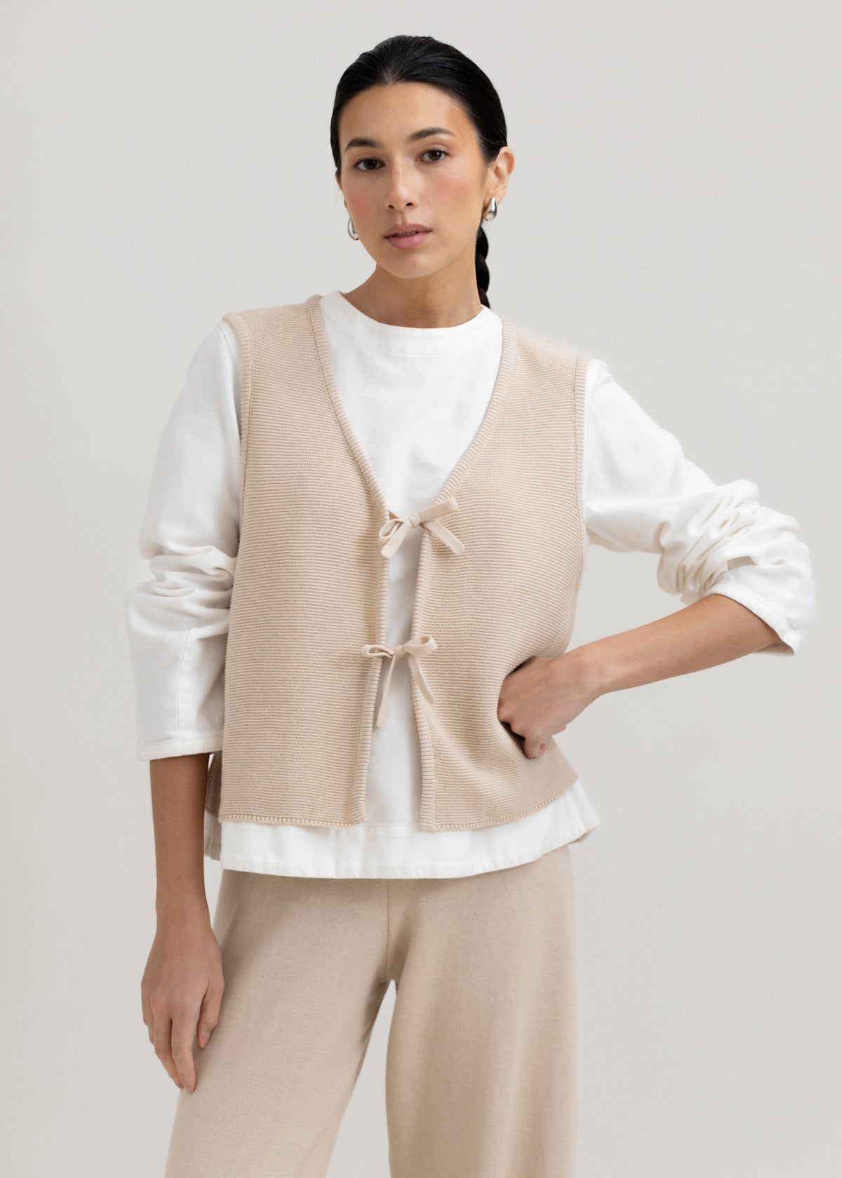 Luzia Vest in Praline, cotton and baby alpaca knit vest by Ahblo, worn by model