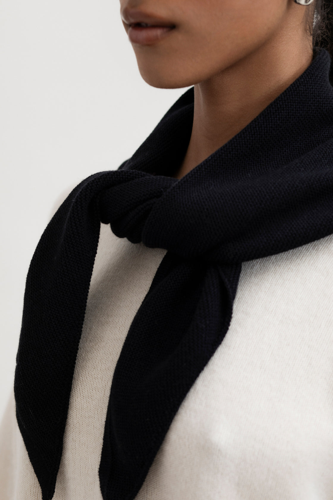Nora Scarf in Black, cotton and baby alpaca triangle scarf by Ahblo, worn by model