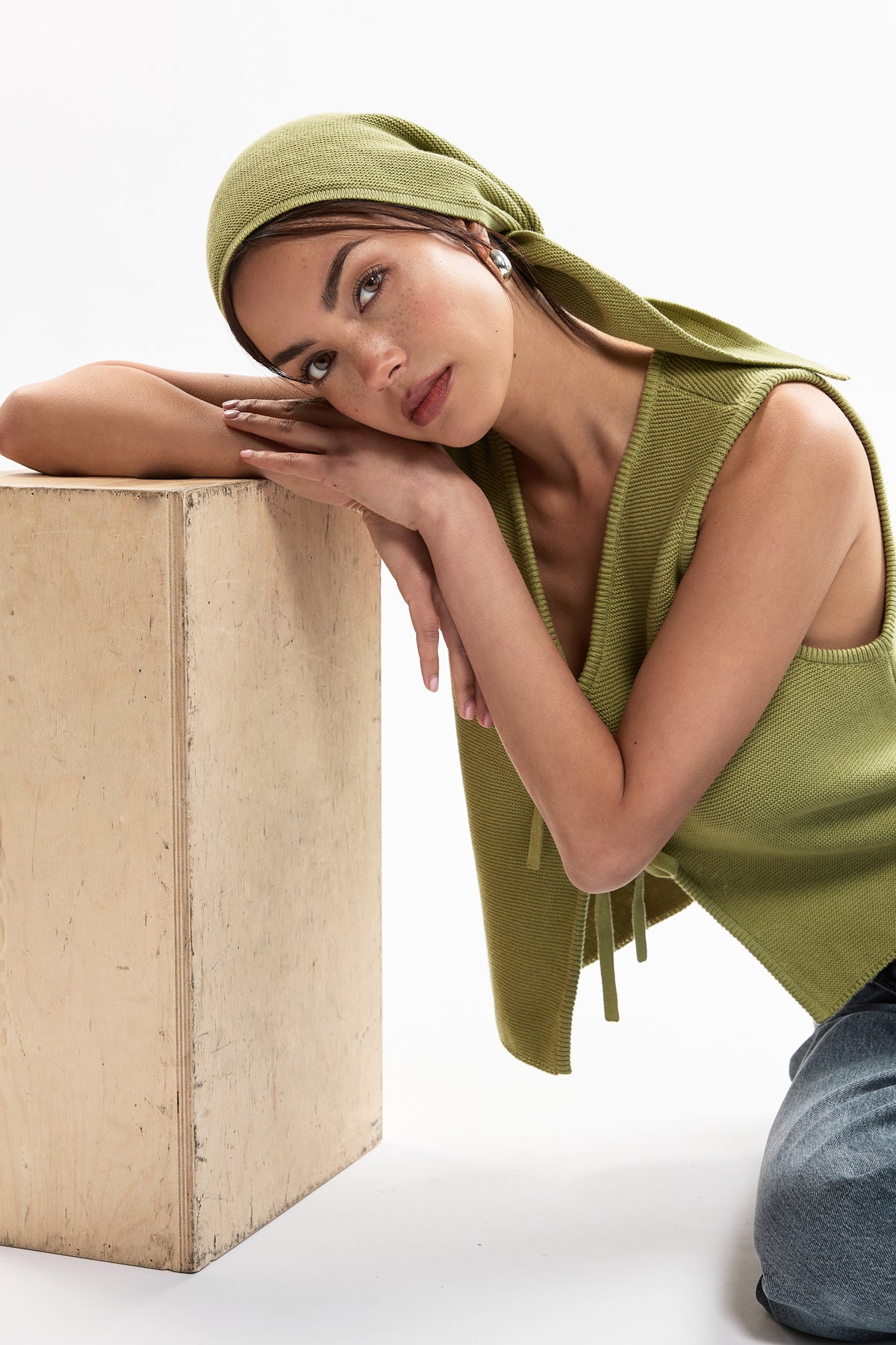 Nora Scarf in Olive, cotton and baby alpaca triangle scarf by Ahblo, worn by model