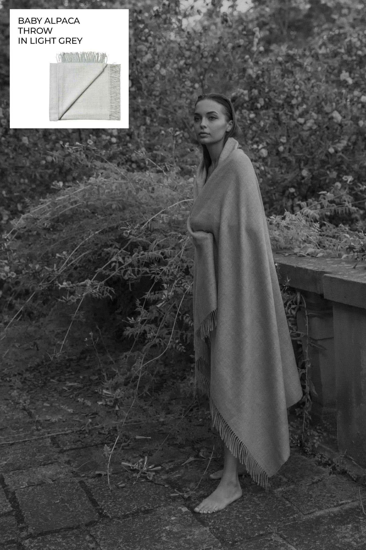 Riley Scarf in Mist Grey, blanket-size baby alpaca scarf by Ahblo, worn by model