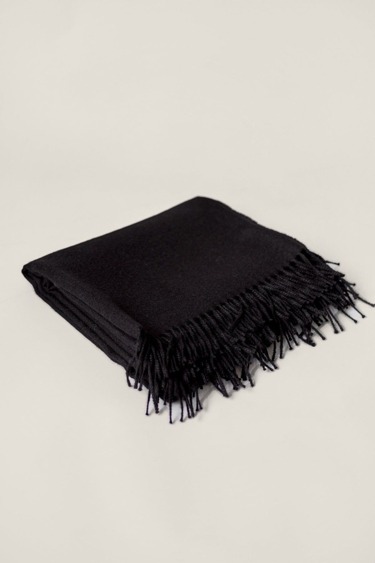 Rowan Scarf in Black, blanket-size baby alpaca scarf by Ahblo, flat lay