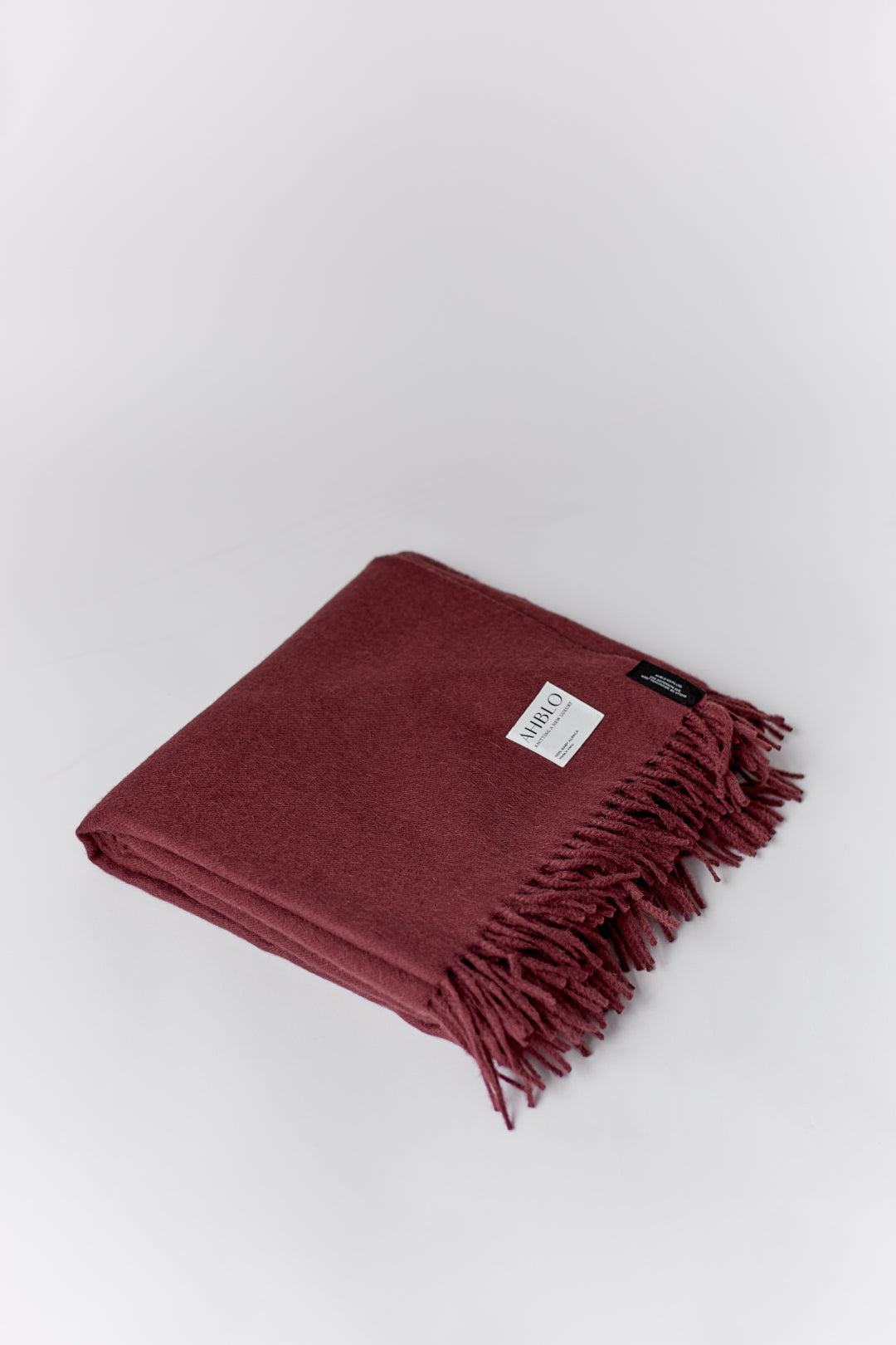 Rowan Scarf in Burgundy, fringed baby alpaca scarf by Ahblo, flat lay