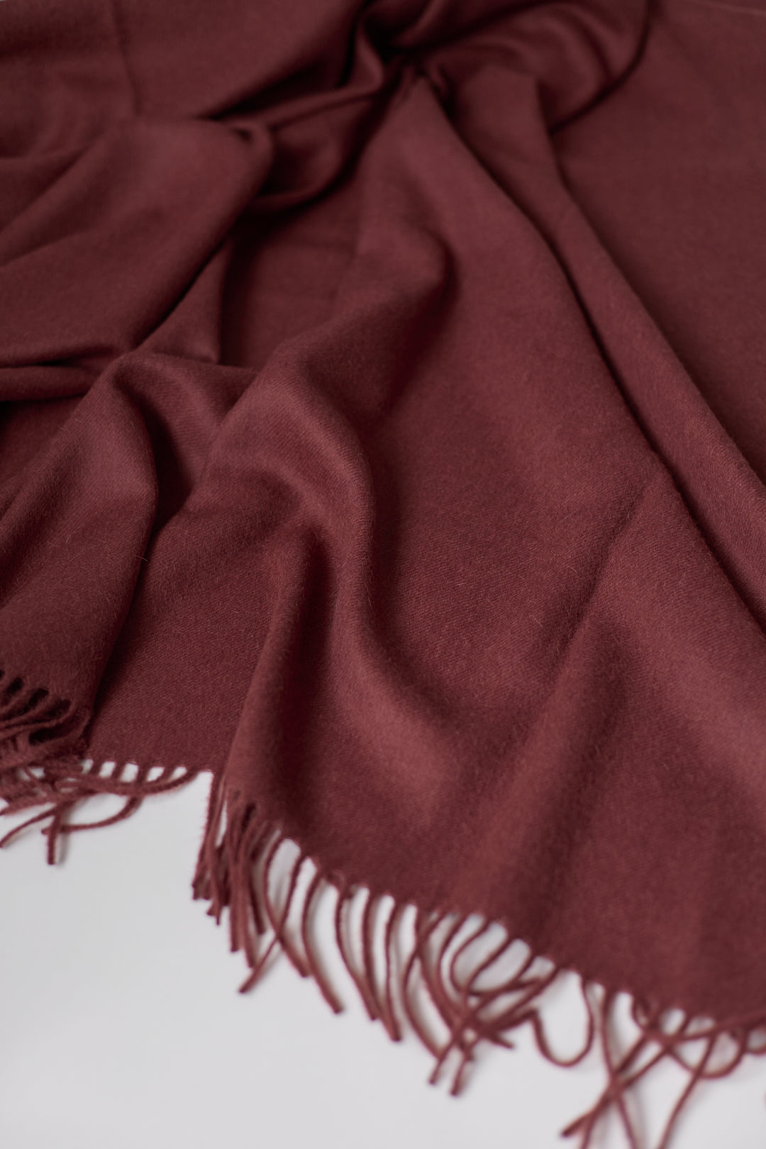 Rowan Scarf in Burgundy, fringed baby alpaca scarf by Ahblo, flat lay