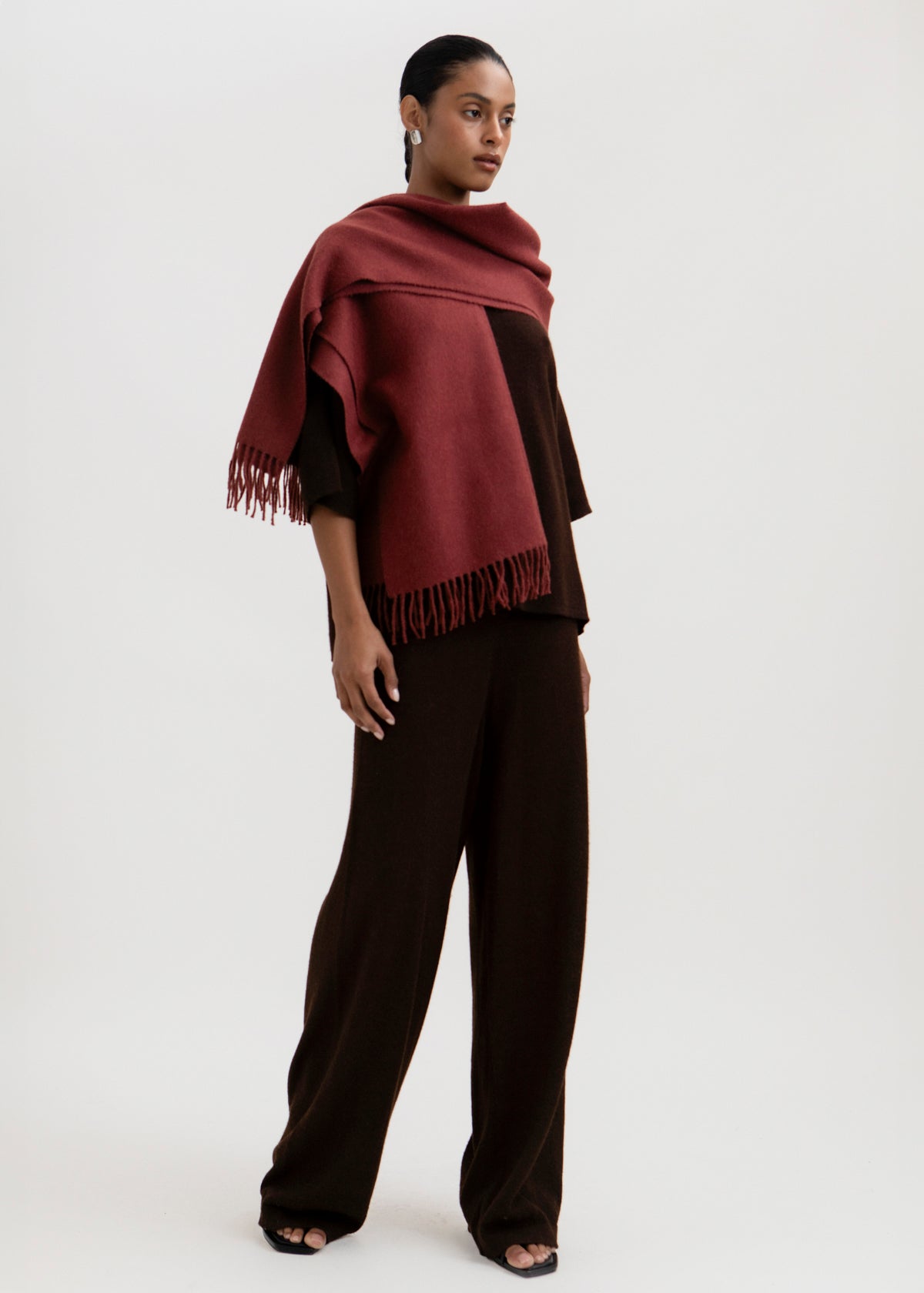 Rowan Scarf in Burgundy, fringed baby alpaca scarf by Ahblo, worn by model