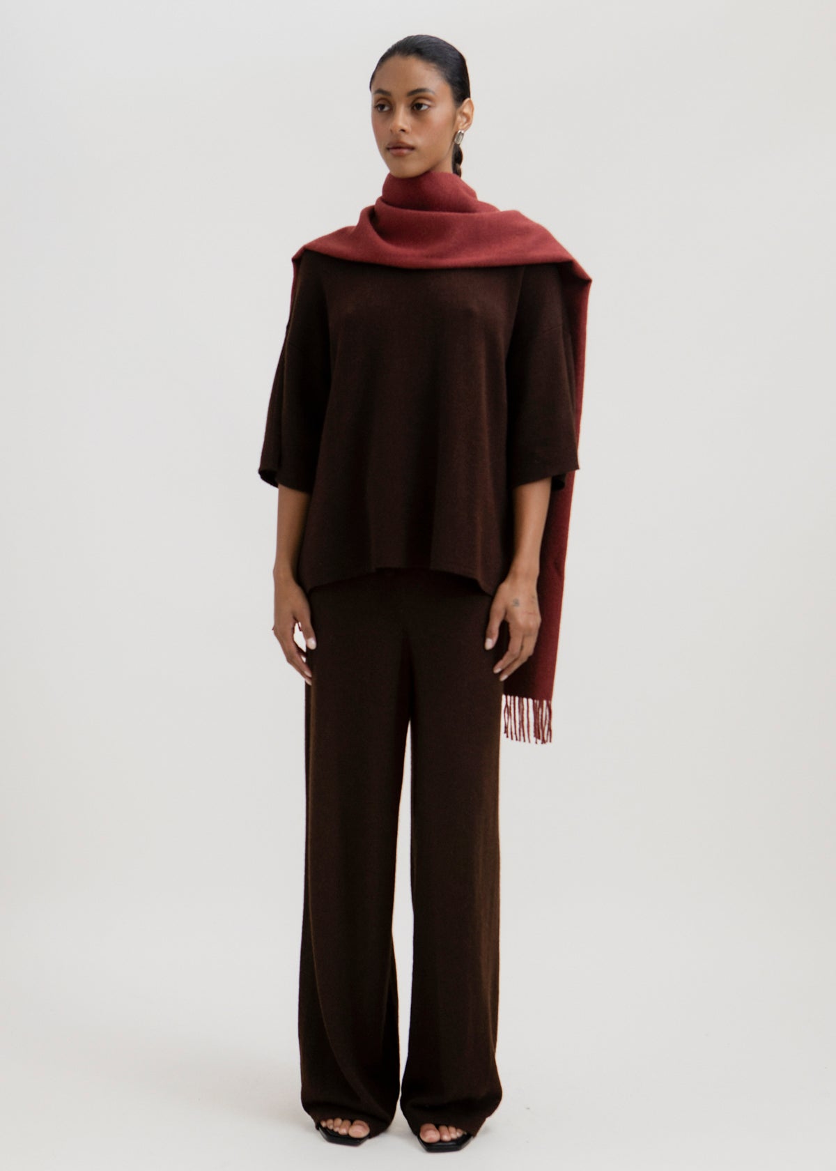 Rowan Scarf in Burgundy, fringed baby alpaca scarf by Ahblo, worn by model