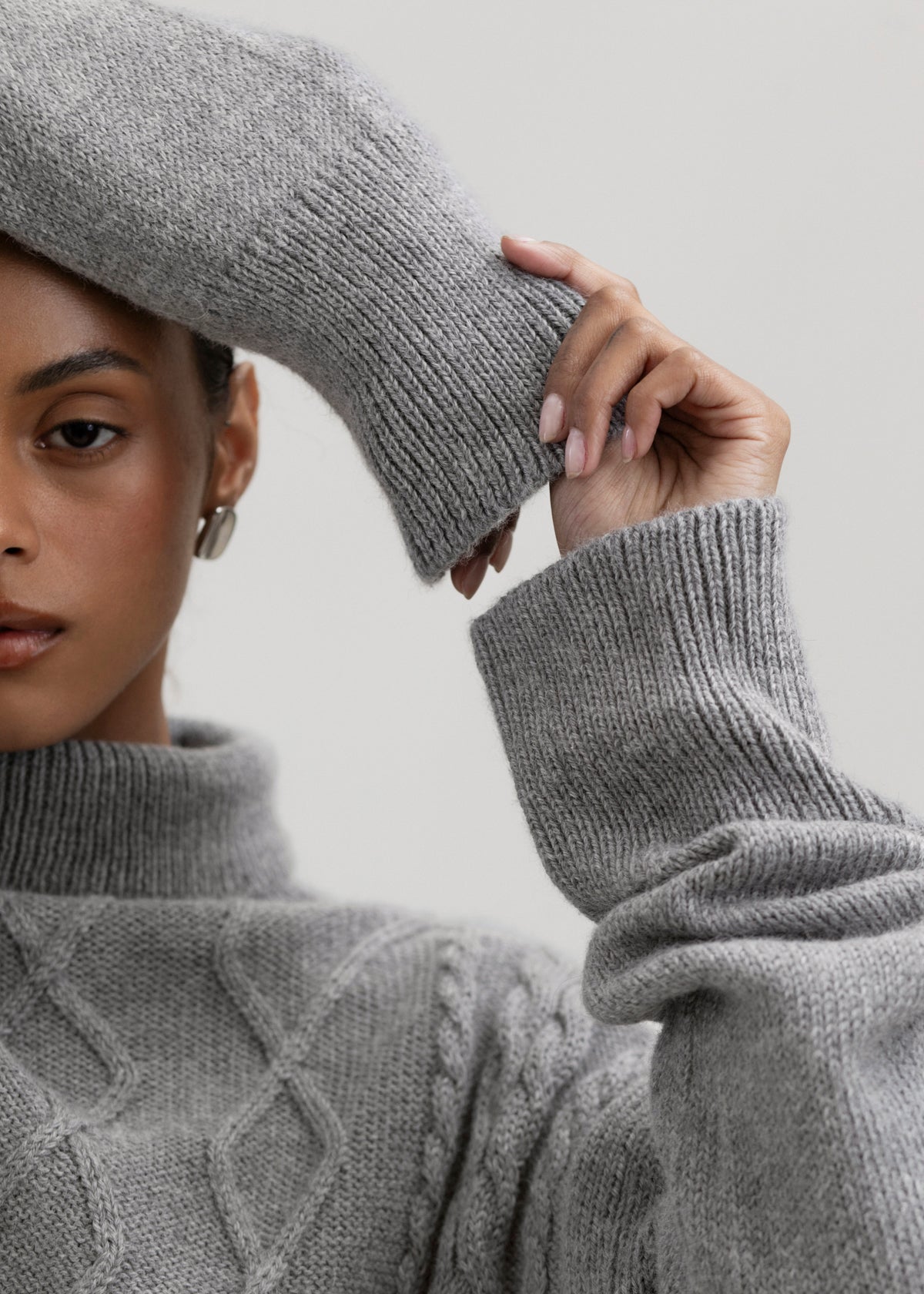 Sierra Cable Knit in Mist Grey, oversized baby alpaca cable-knit sweater by Ahblo, worn by model