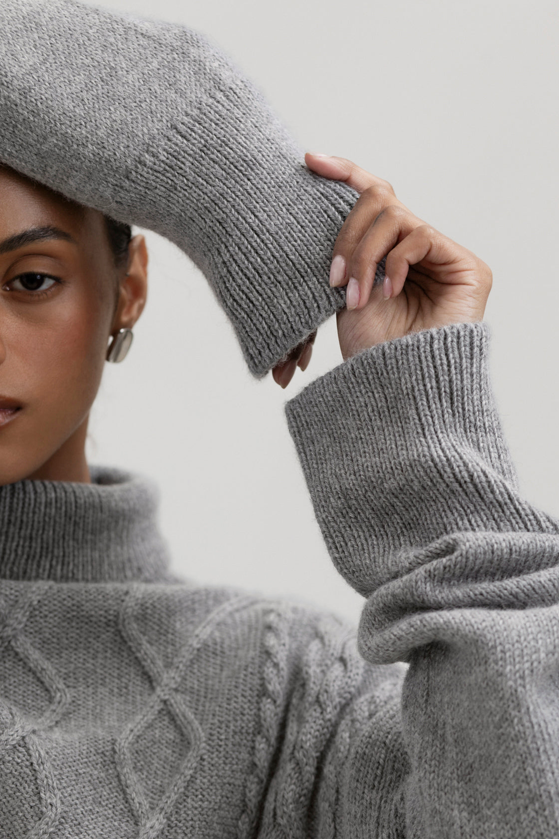Sierra Cable Knit in Mist Grey, oversized baby alpaca cable-knit sweater by Ahblo, worn by model