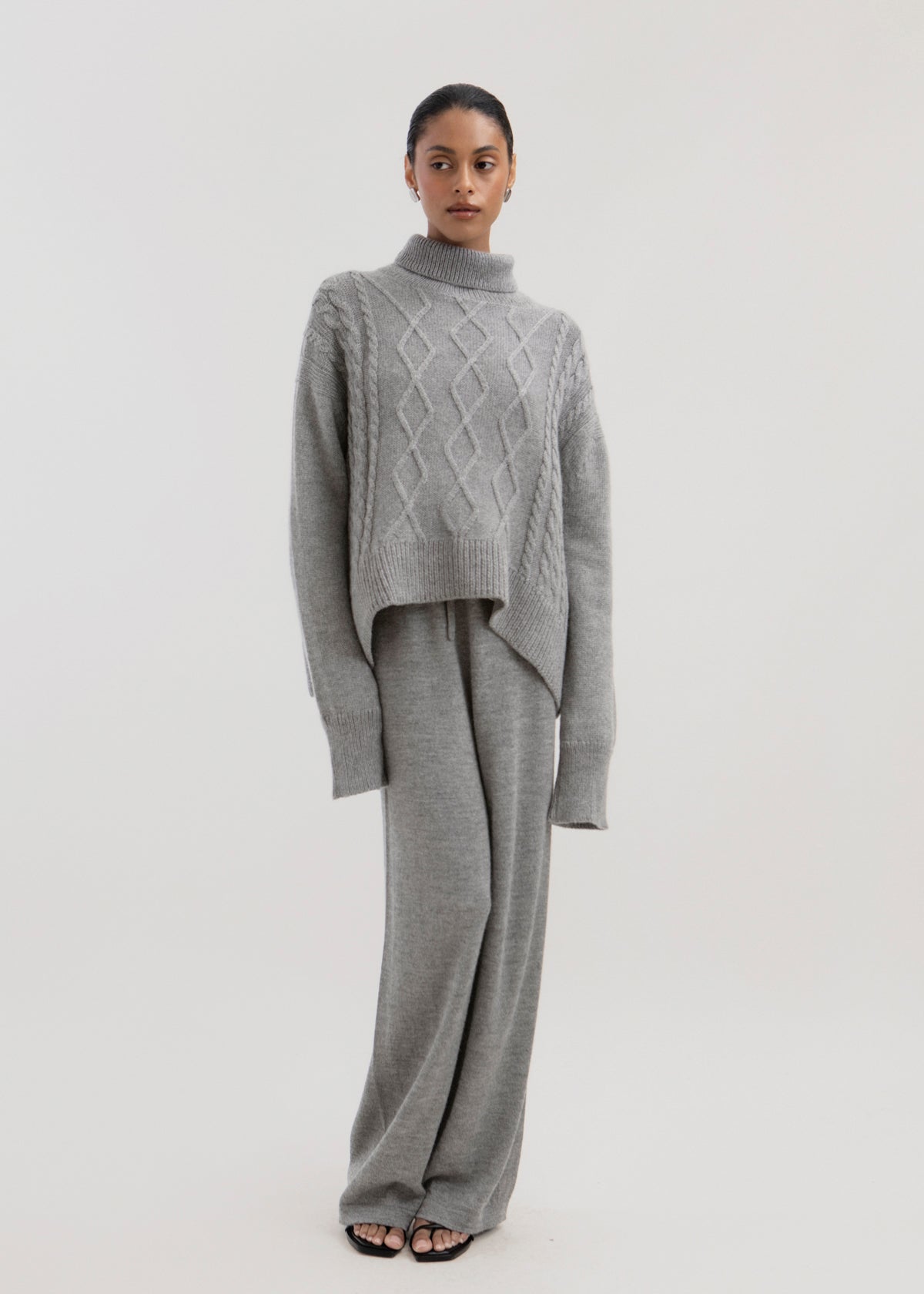 Sierra Cable Knit in Mist Grey, oversized baby alpaca cable-knit sweater by Ahblo, worn by model