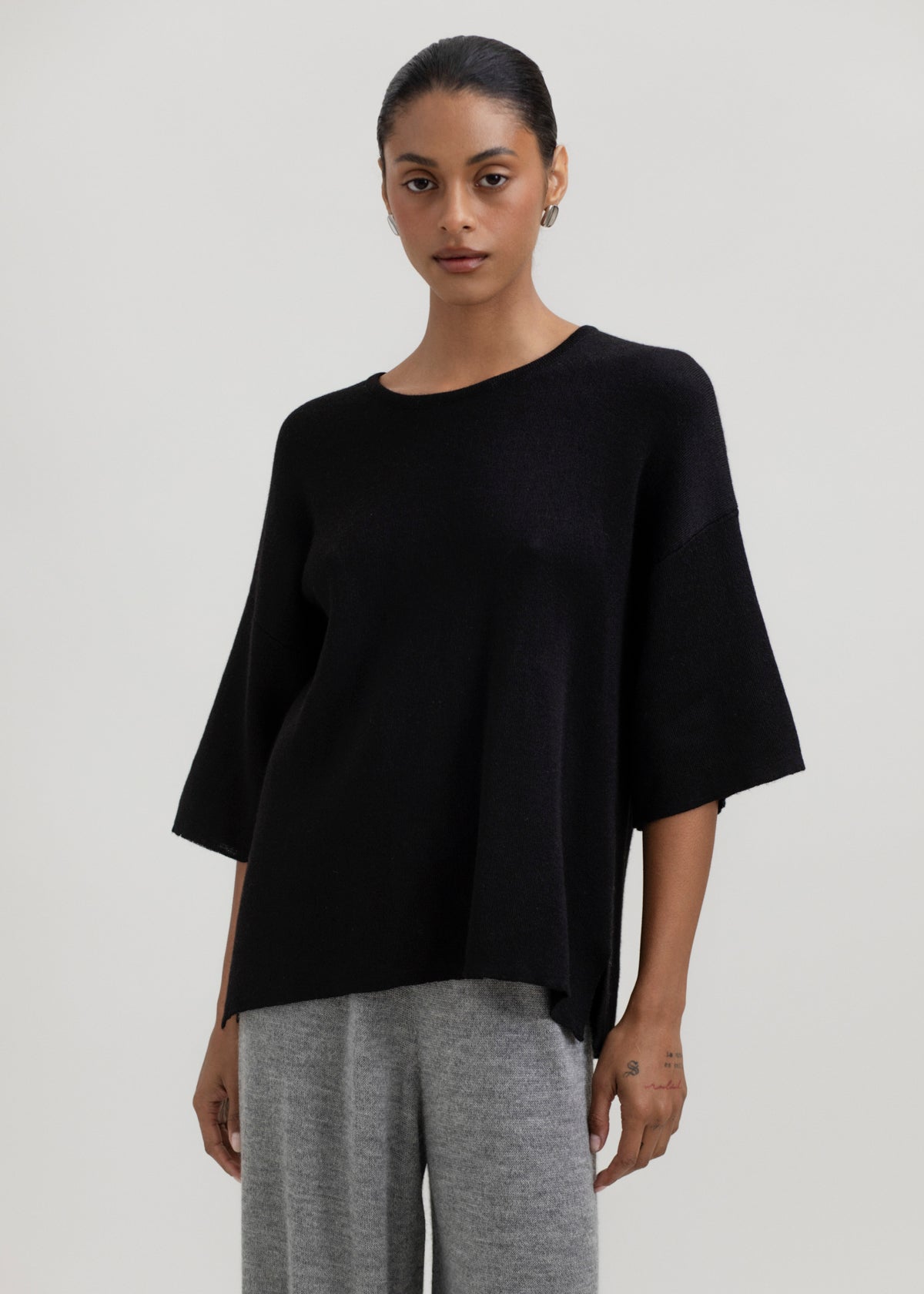 Solace Tee Sweater in Black, alpaca tee sweater by Ahblo, worn by model