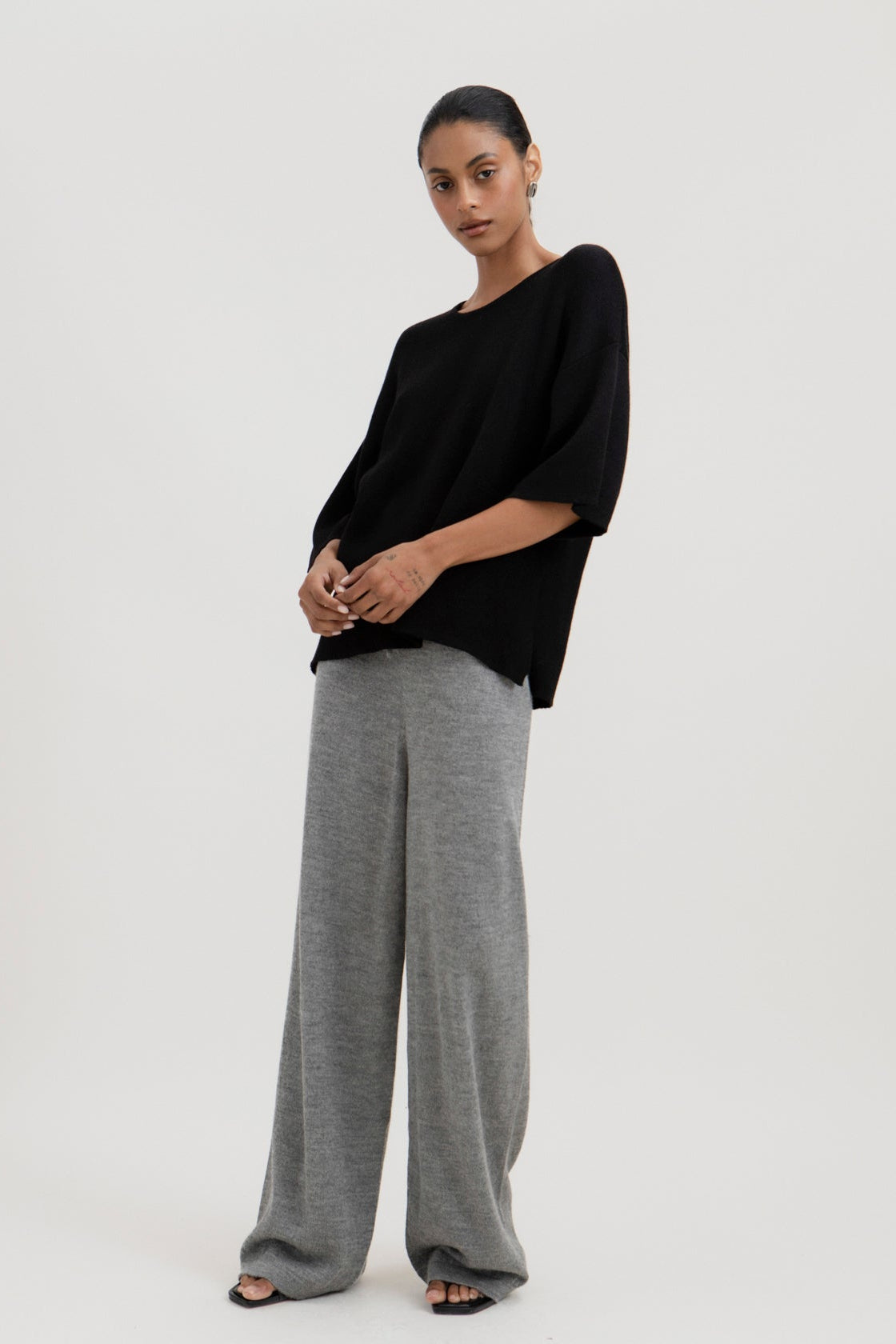 Solace Tee Sweater in Black, alpaca tee sweater by Ahblo, worn by model