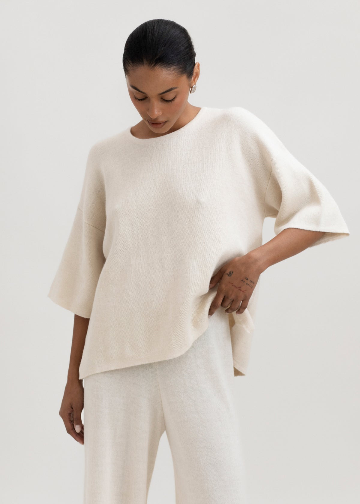 Solace Tee Sweater in Cream, alpaca tee sweater by Ahblo, worn by model