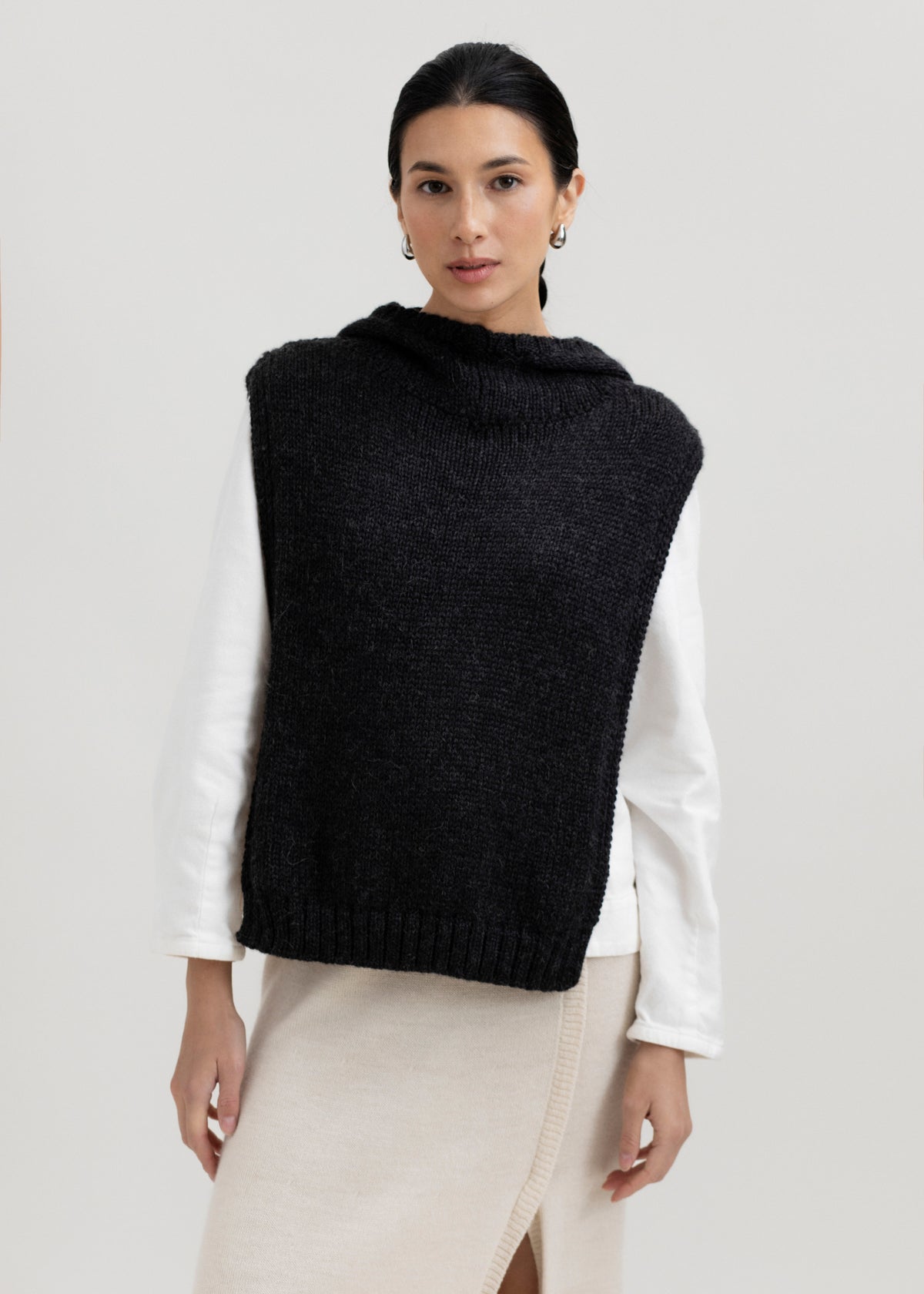 Tofino Poncho in Charcoal, baby alpaca mini poncho by Ahblo, worn by model