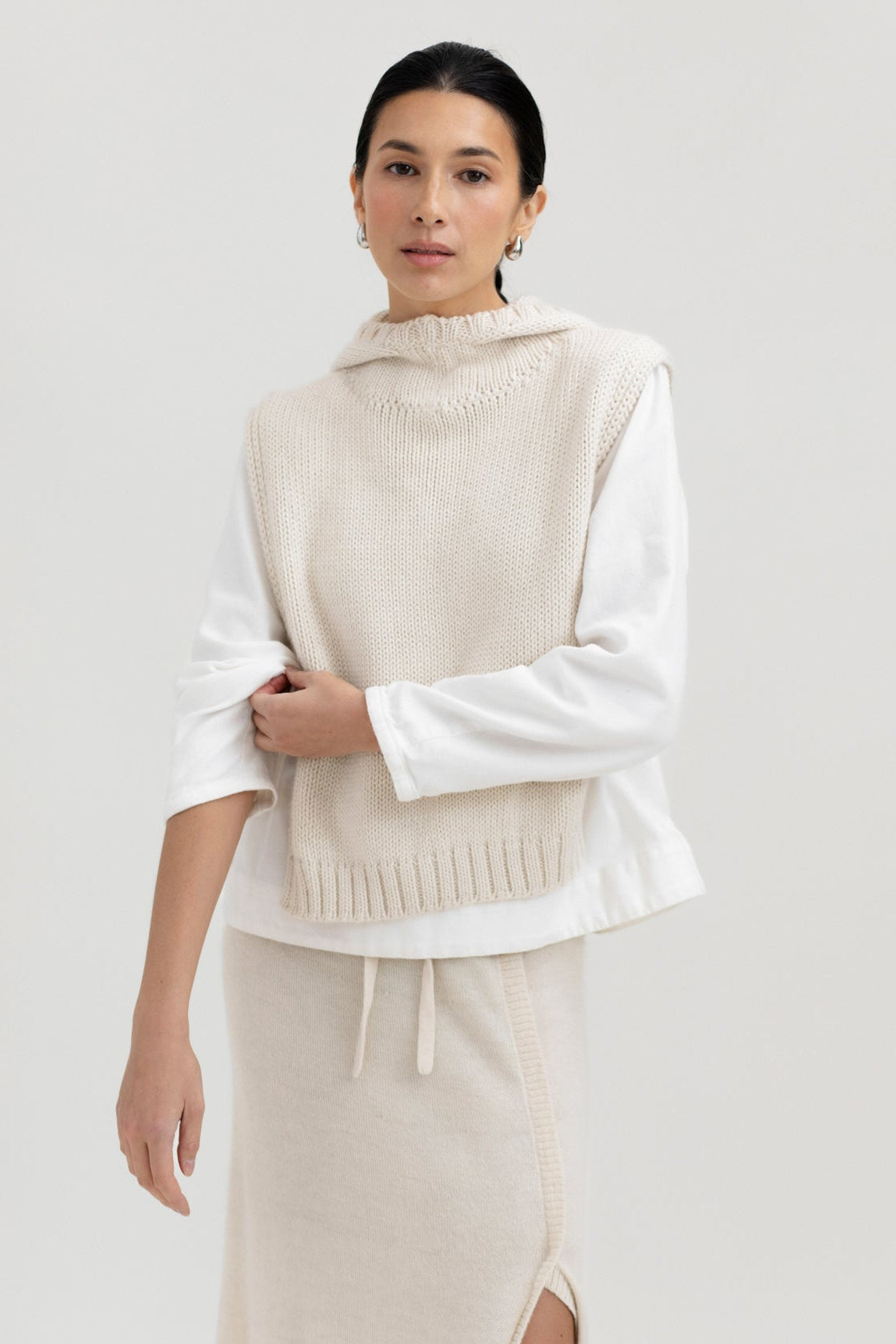 Tofino Poncho in Cream, baby alpaca mini poncho by Ahblo, worn by model
